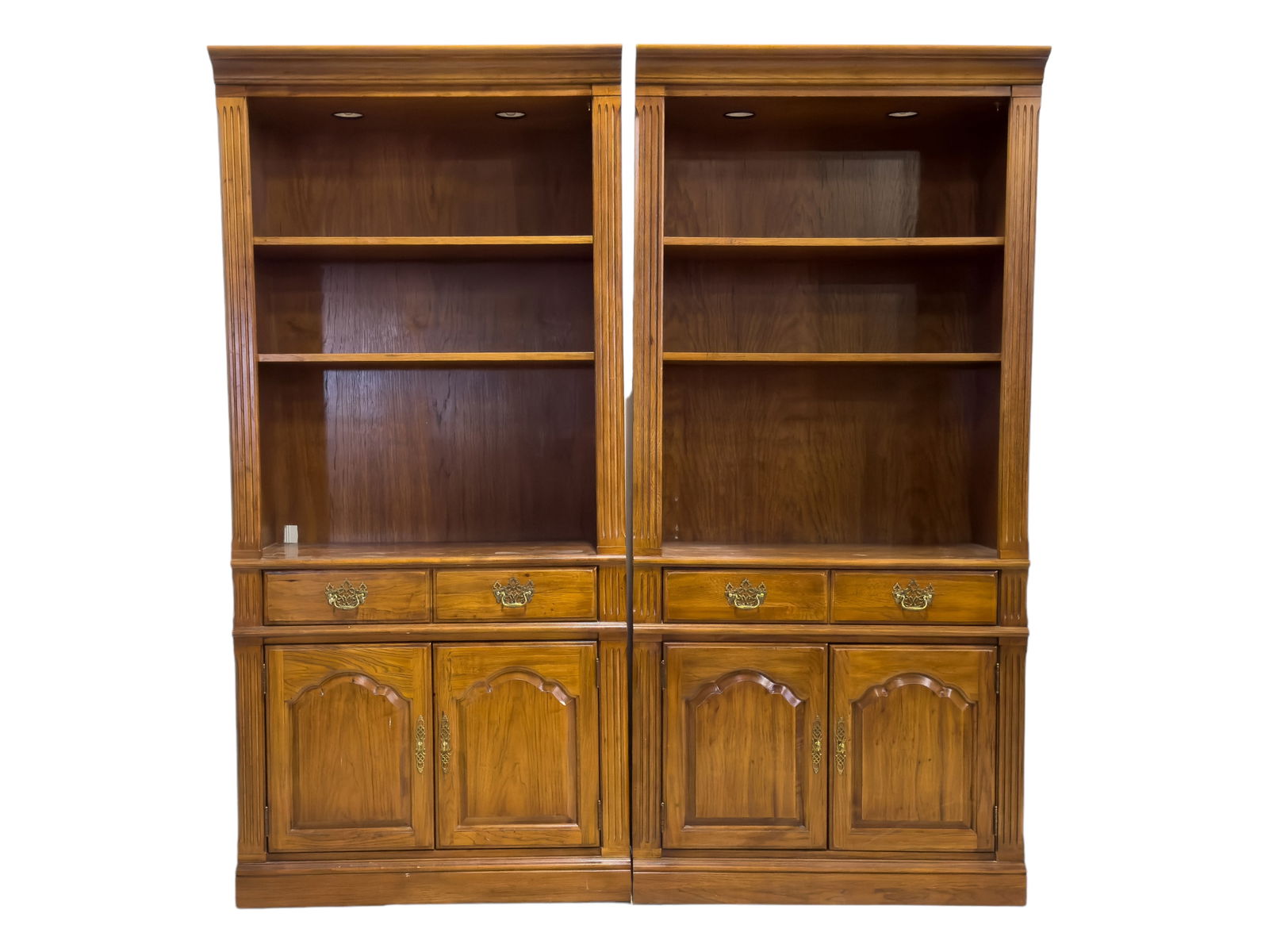 Thomasville Furniture Company: Thomasville Furniture Company bookshelves (2). Shelves measure approx. 6?8? high, 37.5? wide, and 16? deep. Both shelves have display lights, and are electrified.