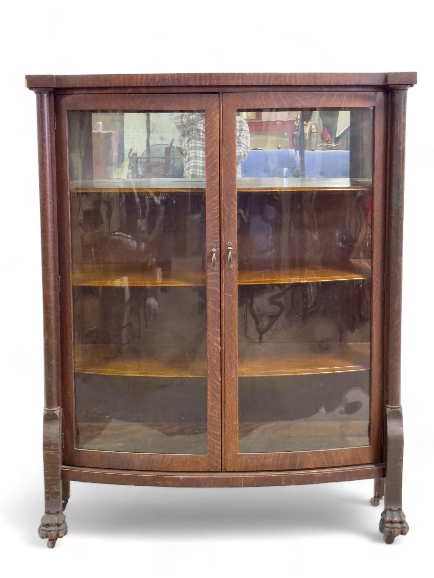 Wood Display Cabinet w/ Mirror: 20th century wooden display cabinet, with claw feet and rollers. Glass is intact, and there is a mirror at back of the top shelf. Measures approx. 60? high, 48? across, and 17.5? deep.