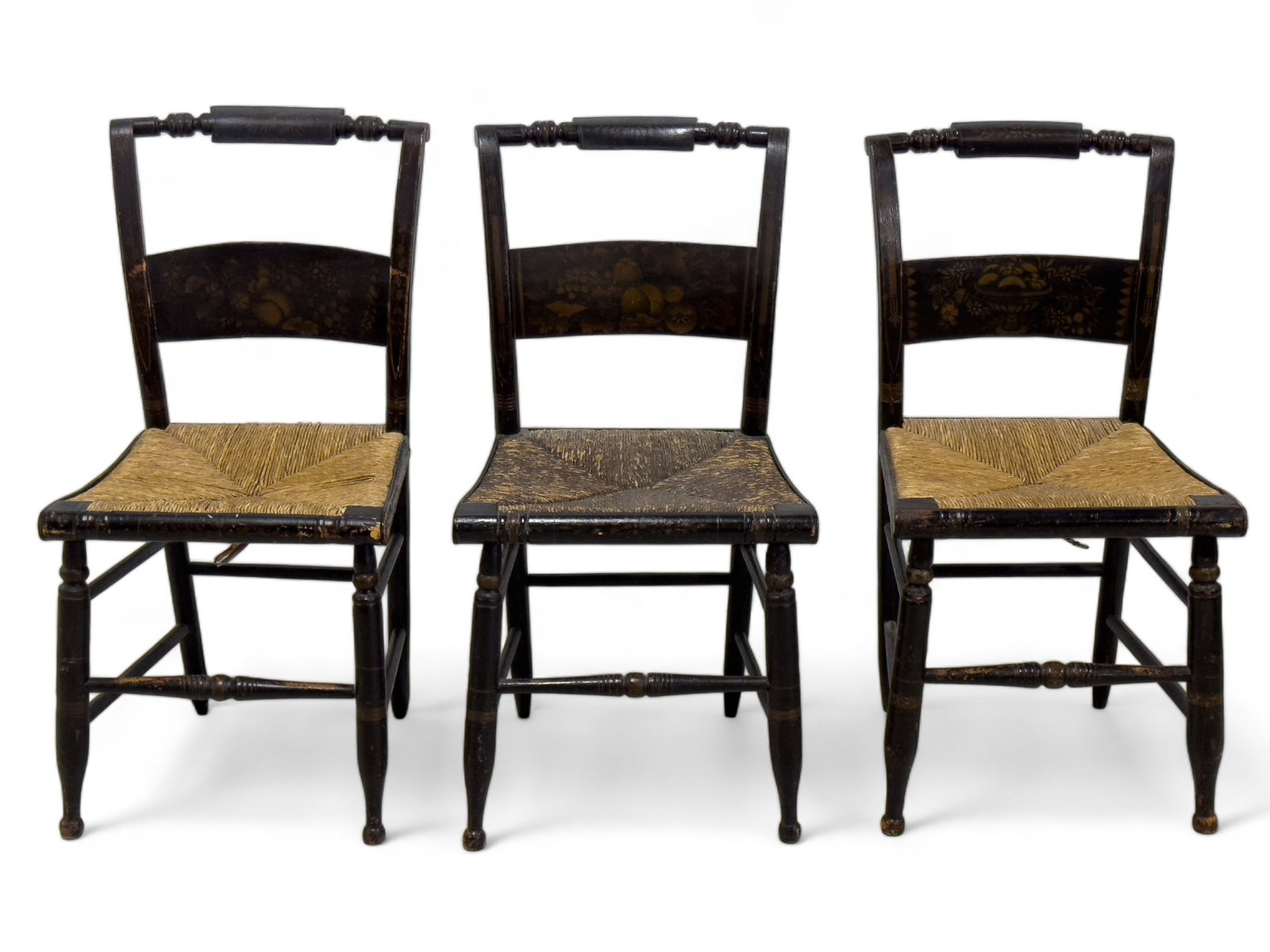 Rush Seat Side Chairs w/ Stenciling: Rush seat side chairs with stenciling depicting fruits, floral scenes. One chair seat is darker than others. Some fading is present in stenciling / original paint. Chair measures approx. 34? high, 17.