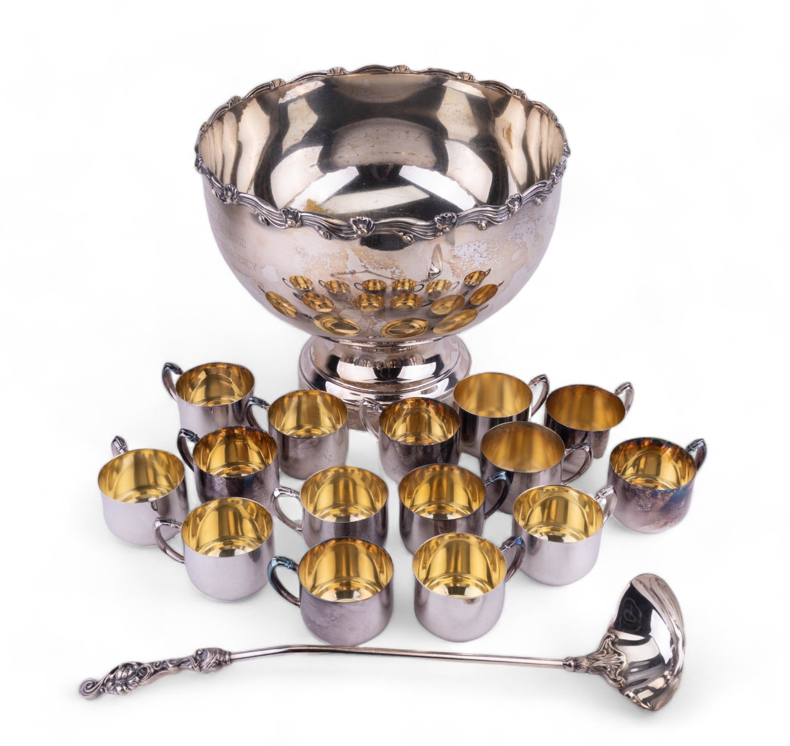 Silver Plate Punch Bowl & Cups: Sheridan silver plated punch bowl with ladle and 15 NEW cups in Art Nouveau style. Bowl measures approx 14" dia x 11.5" H. Has wear on the interior of the bowl.