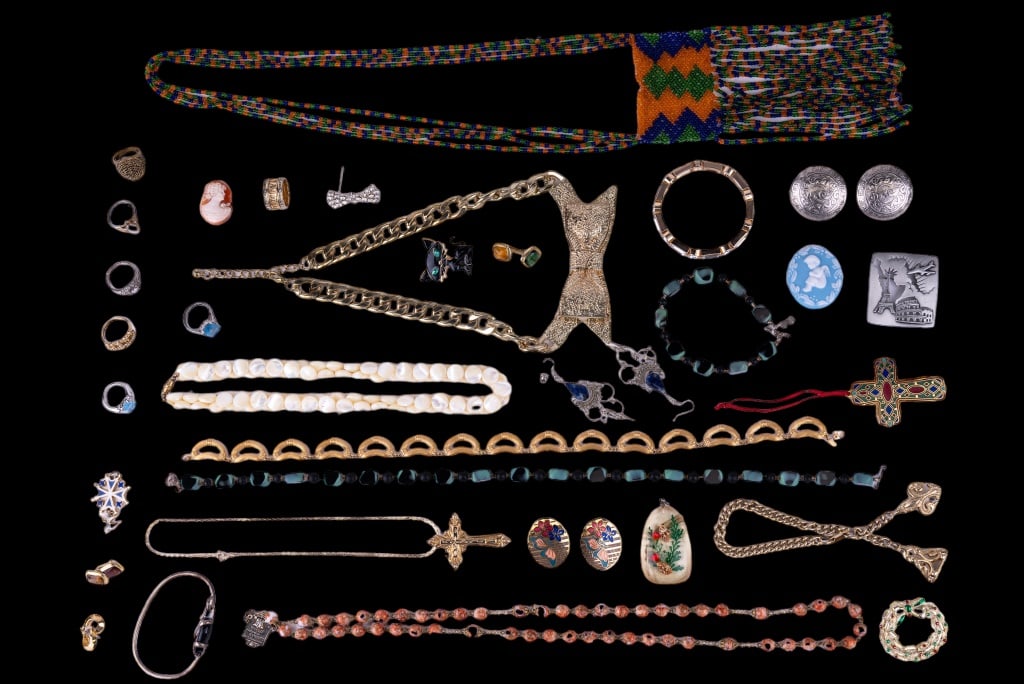 Vintage Jewelry Collection: Sampling includes mother of pearl, stone, large gold tone bow and other necklaces, cat and other brooches, loose cameo, lucite shell pendant, bracelets, rings, clip earrings and more.