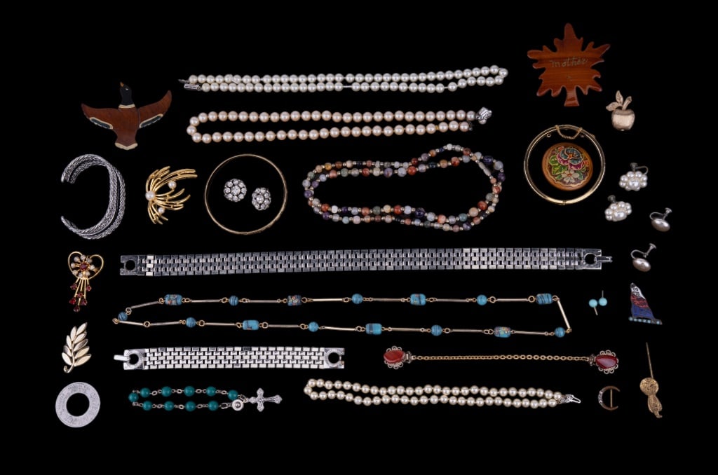 Vintage Estate Jewelry: Sampling includes pearl style necklaces, agate necklace, gold tone bracelets, Monet silver tone necklace, wooden brooches and more.