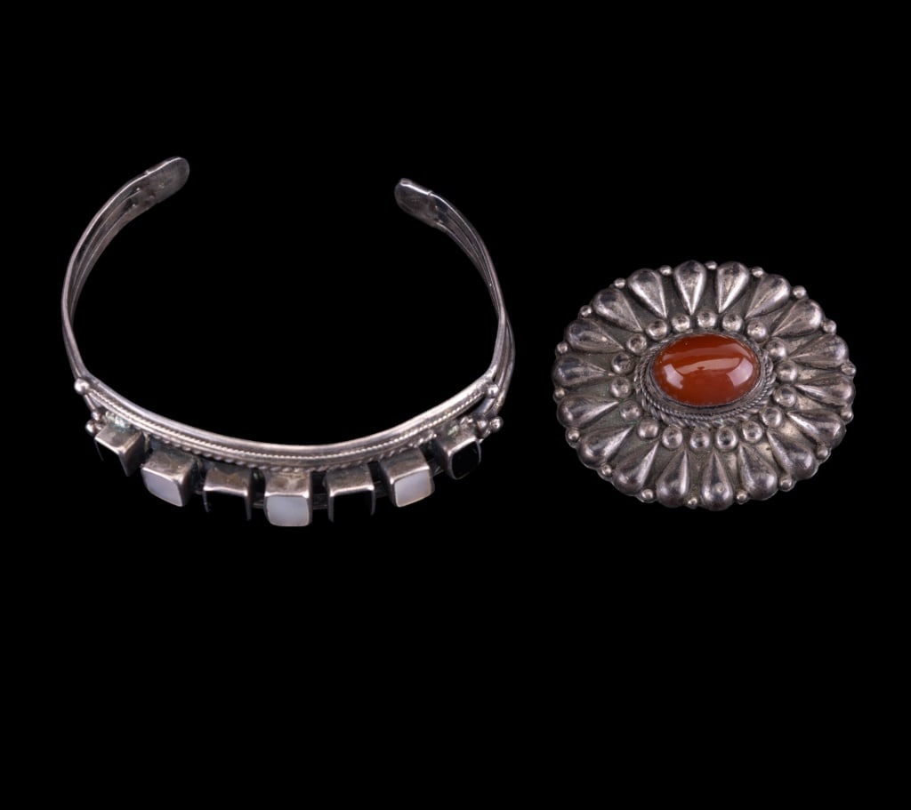 Vintage Native American Sterling Bracelet: Vintage Native American sterling silver black onyx and mother of pearl cuff bracelet (unsigned) and early hand wrought carnelian brooch.