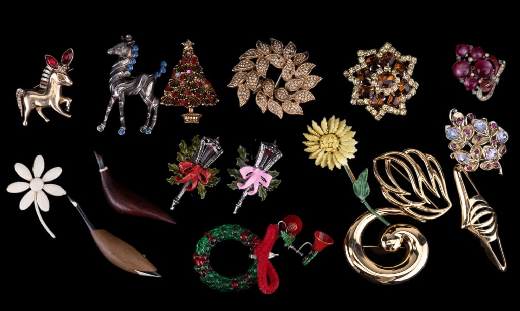Costume Brooches: Includes sterling pony (missing stones), Hollycraft (tree and carriage lights), Ciner (brooch missing stones), Monet gold tone brooches, Sander Co flower and more.