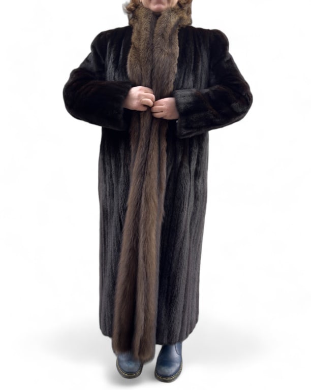 Ladies Full Length Mink Coat: Ladies Full Length Mink coat with raccoon collar. The size is estimated to be a ladies small to medium.