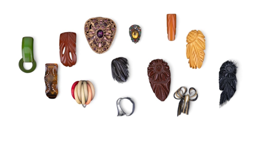 Bakelite & Vintage Clip Collection: Sampling includes nine vintage Bakelite clips including apple juice, carved and other various bright colors, two celluloid clips and more.