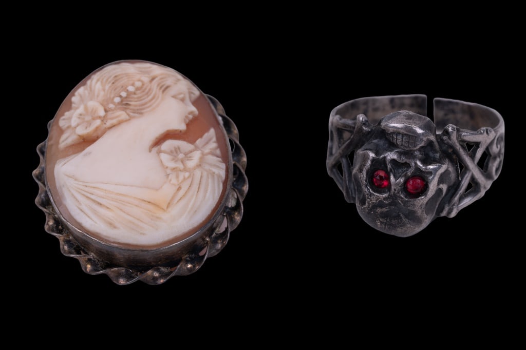 Victorian Sterling Skull & Cameo: Early sterling Victorian skull ring with red eyes and cross bone design and cameo shell carved lady pin (unsigned). Note: ring shank has early as found repairable break.