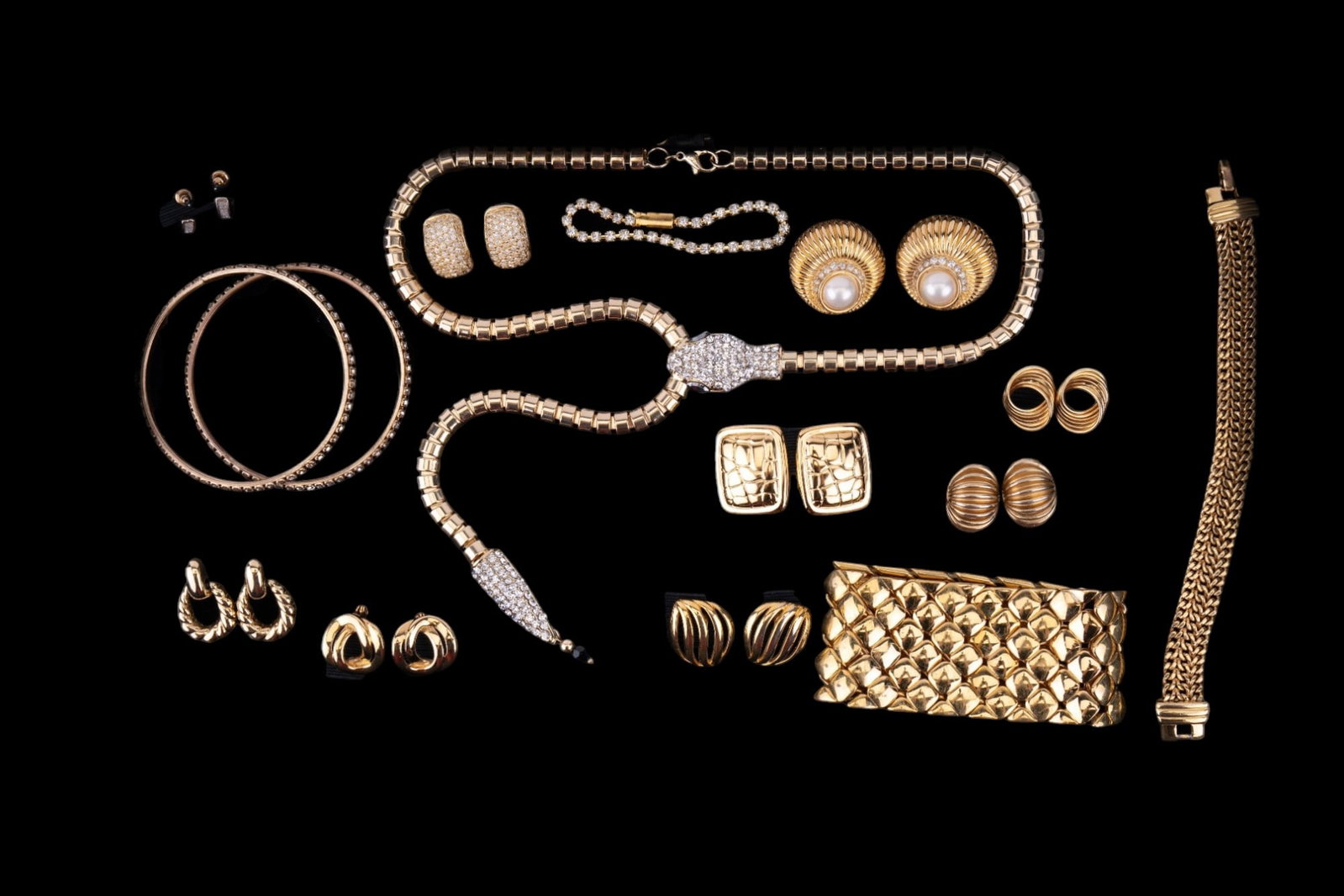 Stunning Snake Necklace and More: Stunning 20" gold tone snake necklace with 8" tail extension. Snake head and tail tip are rhinestone encrusted. Gold tone pronged rhinestone tennis bracelet (6 7/8"). Monet 1/2" wide gold tone chain b