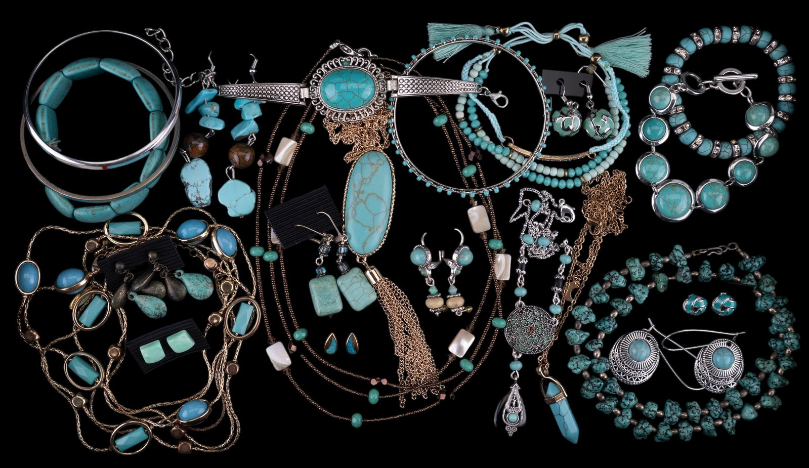 Faux Turquoise Costume Jewelry: 23 pieces of faux turquoise and turquoise style costume jewelry. Lot includes 8 bracelets, 6 necklaces, and 9 pairs of earrings.