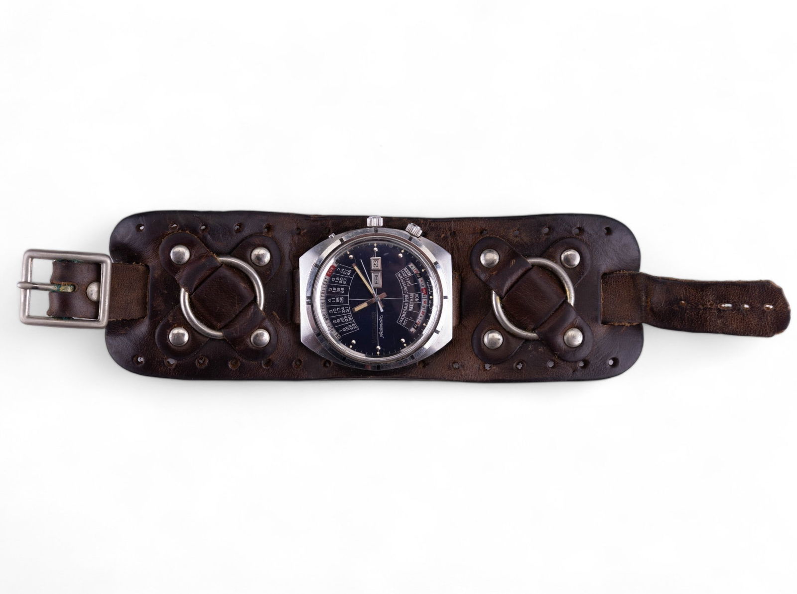 Vintage Wittnauer Men's Automatic Watch: A vintage Wittnauer men's Automatic watch from the 1970's. The watch is on a 8 1/2" x 2" leather band. The watch movement is an Automatic Japan Y6404-013. There are scratches on the crystal due to wea