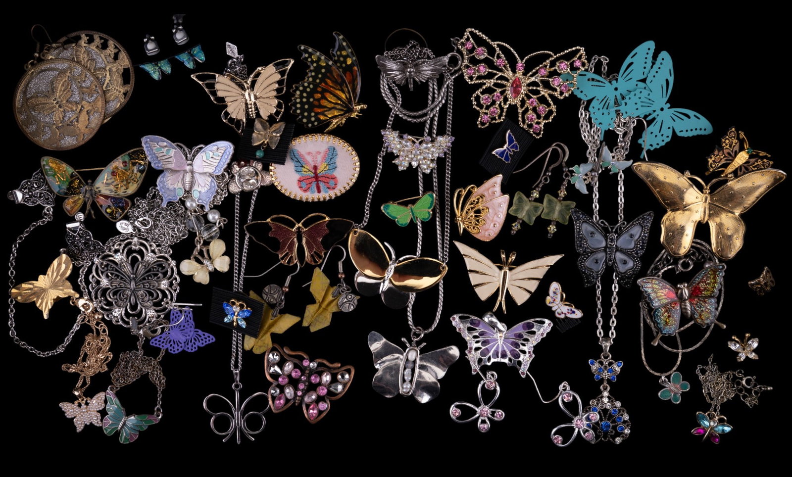 Butterfly Costume Jewelry: 46 pieces of butterfly costume jewelry including earrings, pins, necklaces, tie tacks, a sweater clip, and a ring.