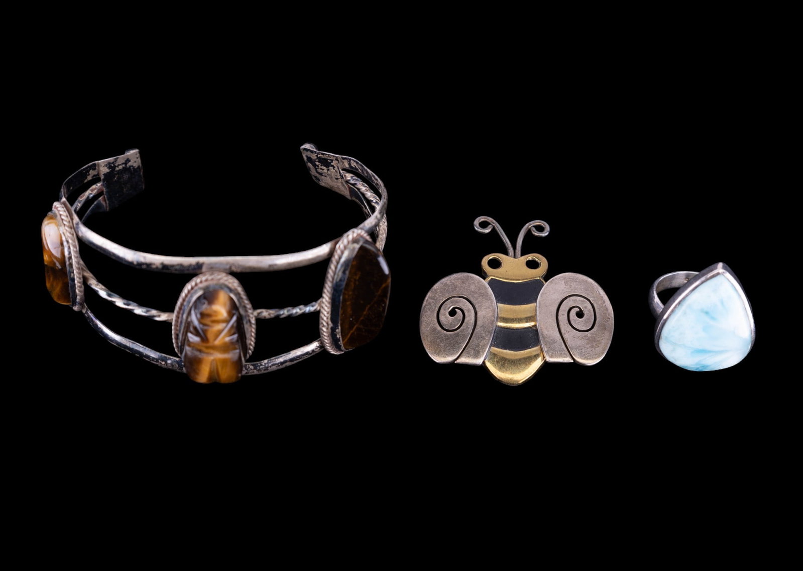Vintage Sterling and Tiger Eye Jewelry: Early Mexico sterling carved tiger eye cuff bracelet, mixed metal artisan bee brooch and large blue larimer unsigned sterling silver ring (size 6.5)