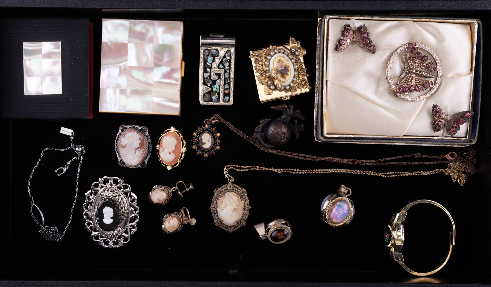 Cameo, Compact & Vintage Jewelry: Highlights include shell and other cameo necklaces, earrings, butterfly vintage purple rhinestone brooches (in original satin lined box), pill box, compact, Mexican, Coach bracelet and more.