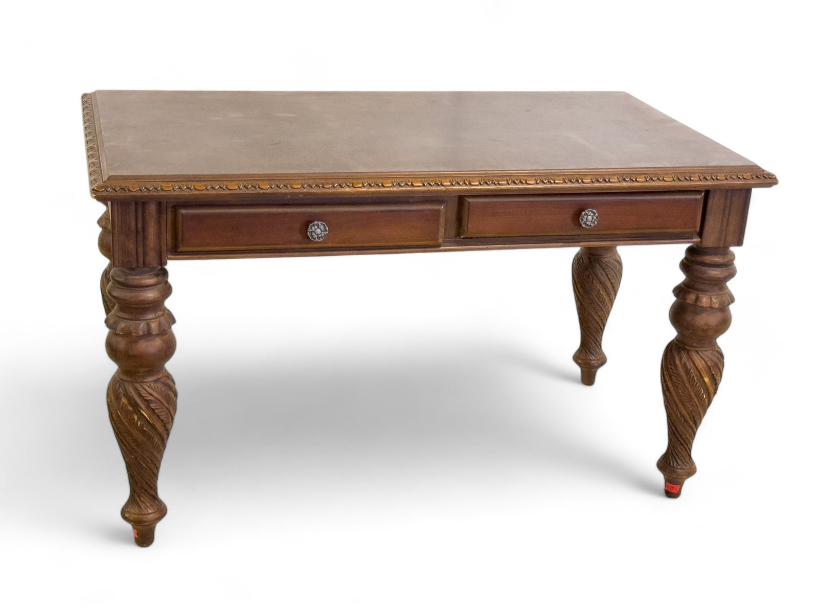 Antique Style Desk: Antique-style solid wood desk with 2 drawers, ornate edging and turned legs. Mahogany finish. Measures approx 52"L x 30"D x 30.5"H. Minor wear to desktop edges.