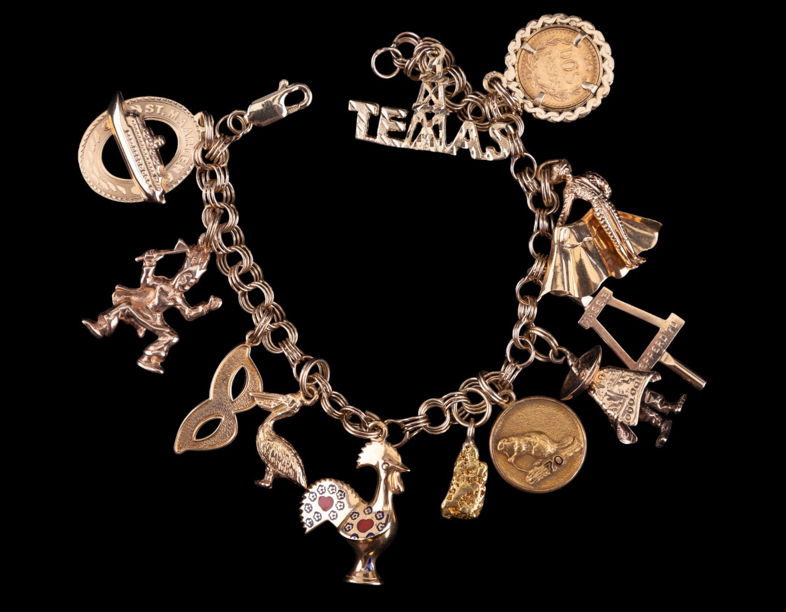 14K Gold "Dos Pesos" Charm Bracelet: Charm bracelet marked 585 (14K) with charms including 1945 "dos pesos" (illegible frame), 1 gold plated, one 10K gold, and 4 unmarked ((*2 may not be gold/ untested). Total weight approx 30.9 grams an