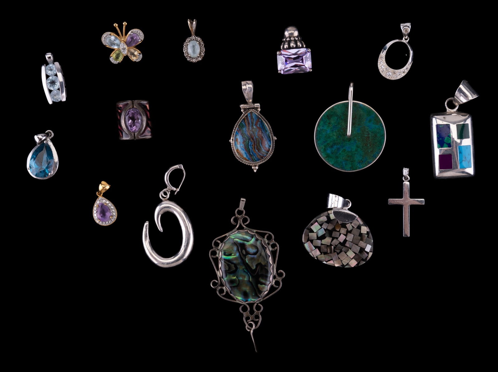 Sterling Silver Semi-Precious Pendants: 15 sterling silver and semi-precious pendants including some with stones that test in the range of mother of pearl, marcasite, abalone, blue topaz and more. The pendant with abalone has an approx 2.5"