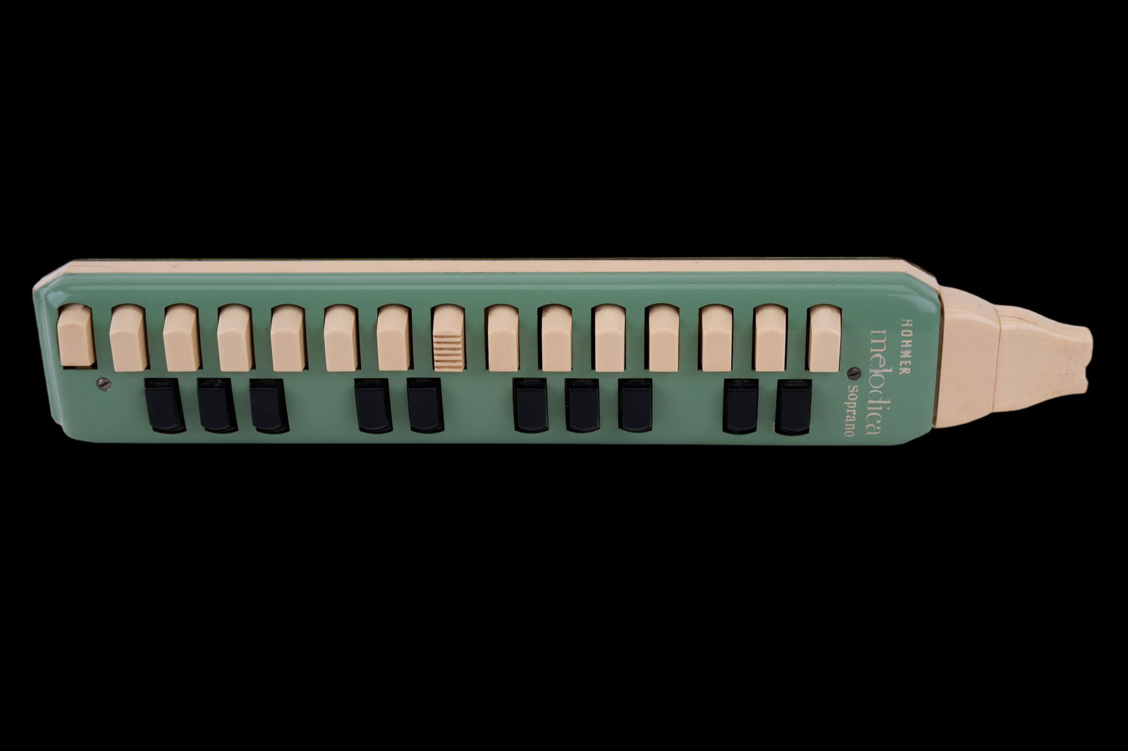 Hohner Melodica Soprano German Made Instrument: Overall in good condition, small chip on bottom white button, along with a chip in the mouthpiece (as seen in photo). Also, there is a tiny dent in metal in front of Melodica.