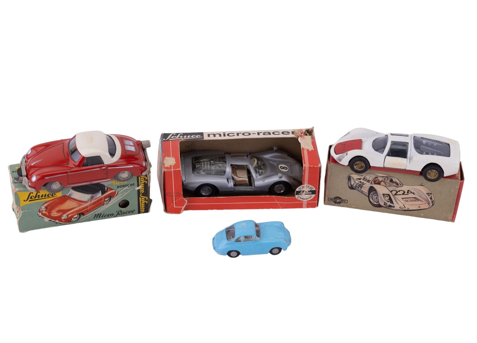 Vintage Porsche "Schuco" Die-Cast and H.O. Cars: Includes 2 Schuco Porsches with boxes (1047 has key in box), "Mercury" die-cast Porsche, Faller H.O. blue Porsche (missing a brush). Boxes in fair condition.
