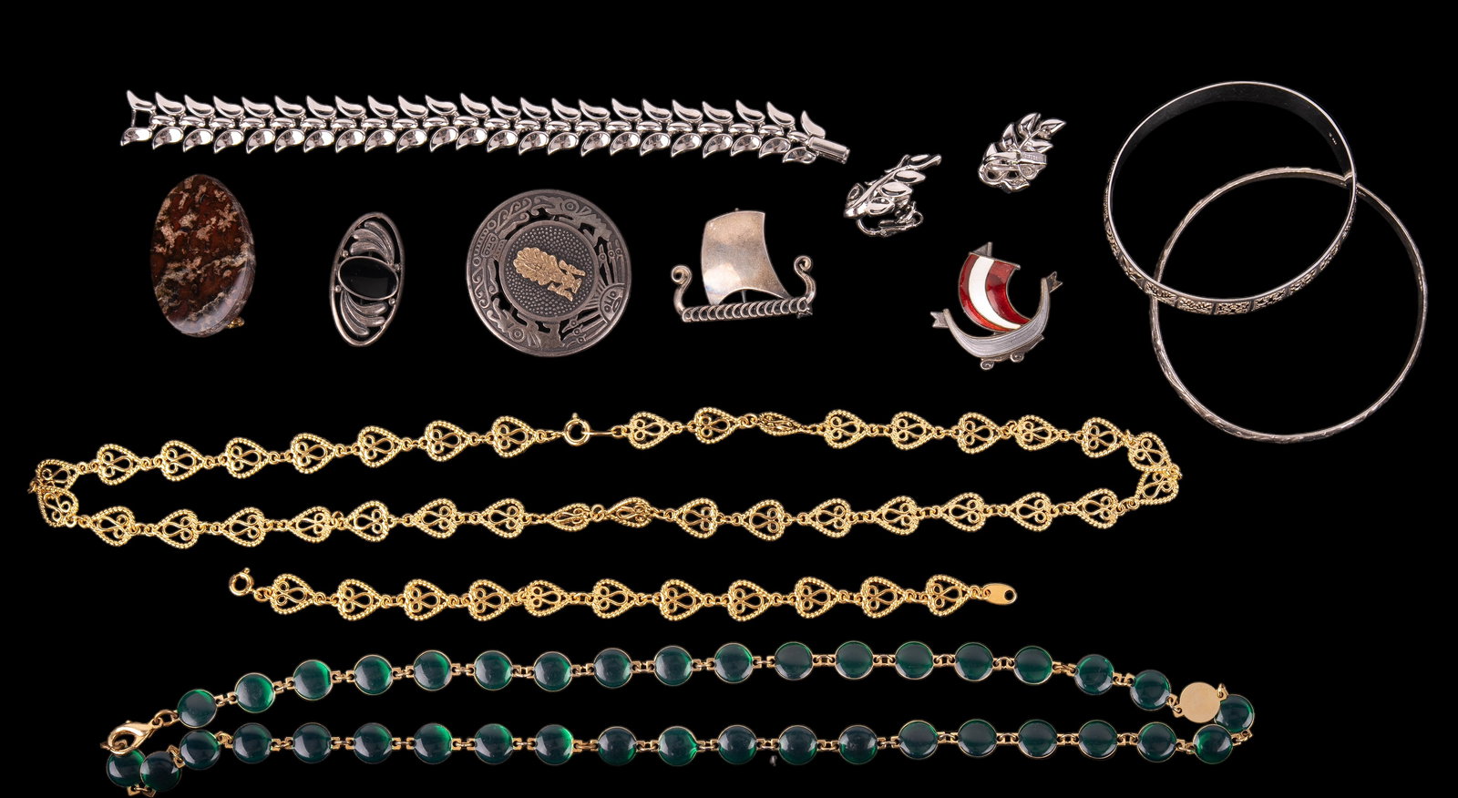 Denmark Sterling and Semi-Precious and Trifari: Includes 2 sterling bangles, Norway sterling Viking ship brooch with loss in enamel on sail, Denmark sterling Viking ship brooch, Mayan/Aztec style sterling brooch, onyx brooch, marble stone brooch, 2