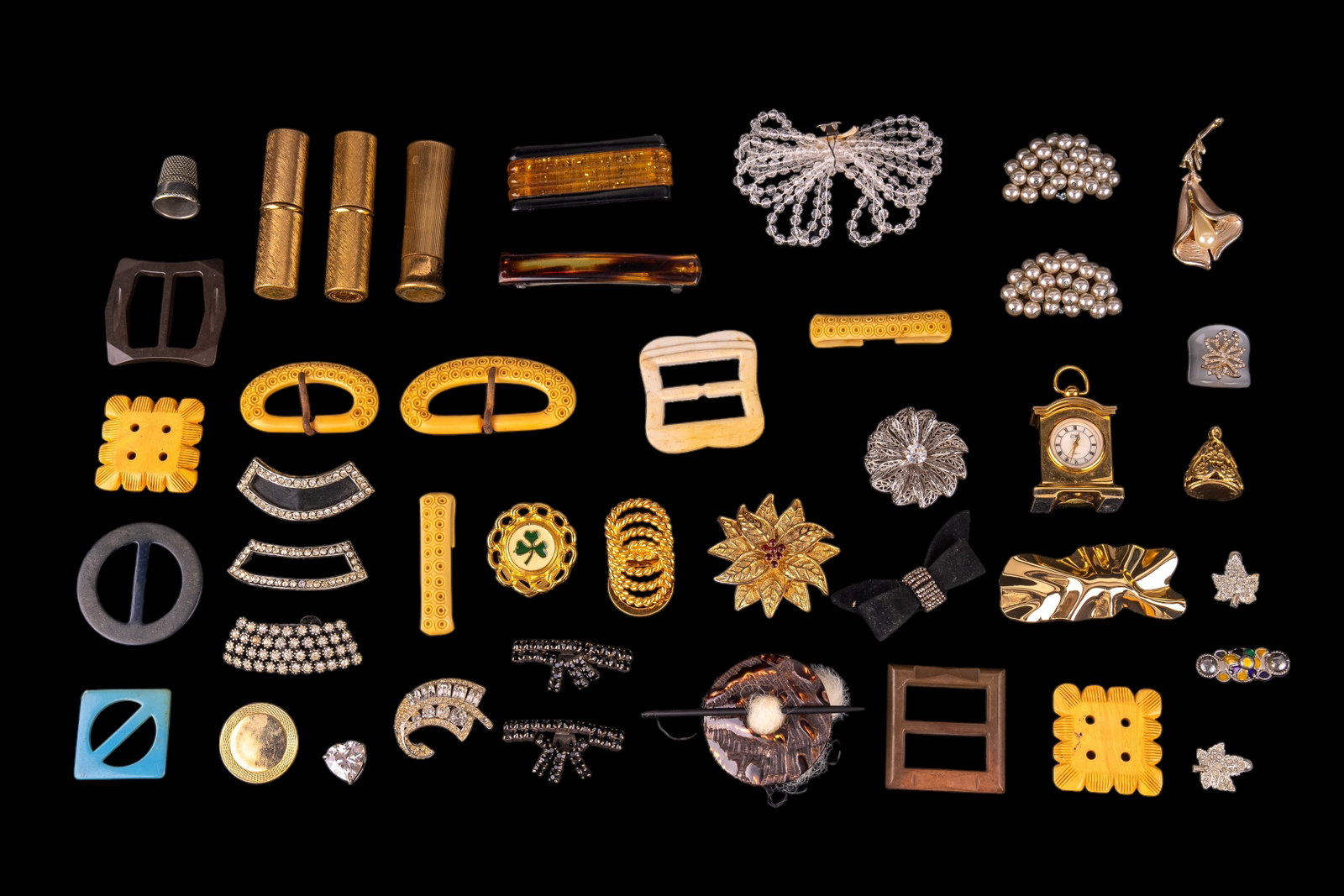 Vintage Buckles Shoe Clips and More (40 pcs): Includes 3 lipstick holders and assorted hair clips, shoe clips, pendants, and others with rhinestones and faux pearls. Also includes belt buckles of natural material, Bakelite, and Bakelite style mat