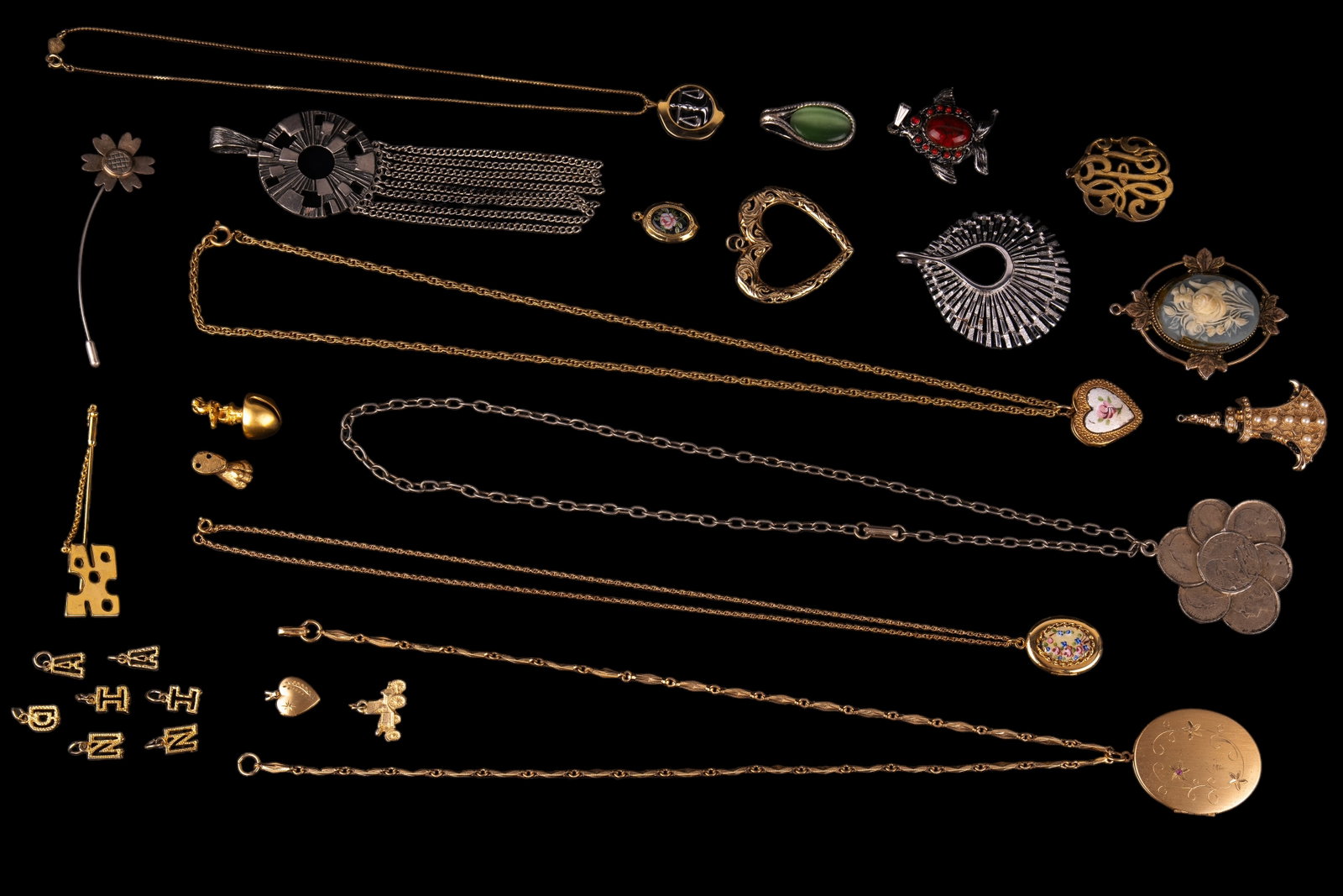 Vintage Necklaces, Pendants, Pins, and Charms: 11 pendants of glass, faux pearls, in floral and heart motifs including lockets, a cameo, and one by Trifari. 5 necklaces with lockets (3) and one by Biagi. 2 stick pins (one is sterling), and 9 charm