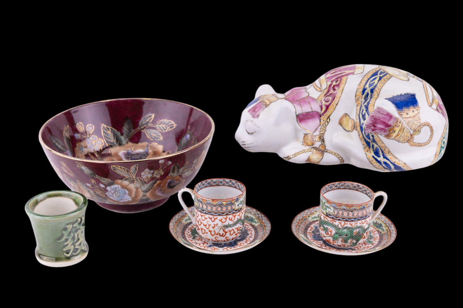 Asian Porcelain: Lot of Asian porcelain including dragon tea cup and saucer set (2), sake cup by Fisherman's Fortune, floral rice bowl by Toyo measuring approx 8" Dia, and a lucky sleeping cat.