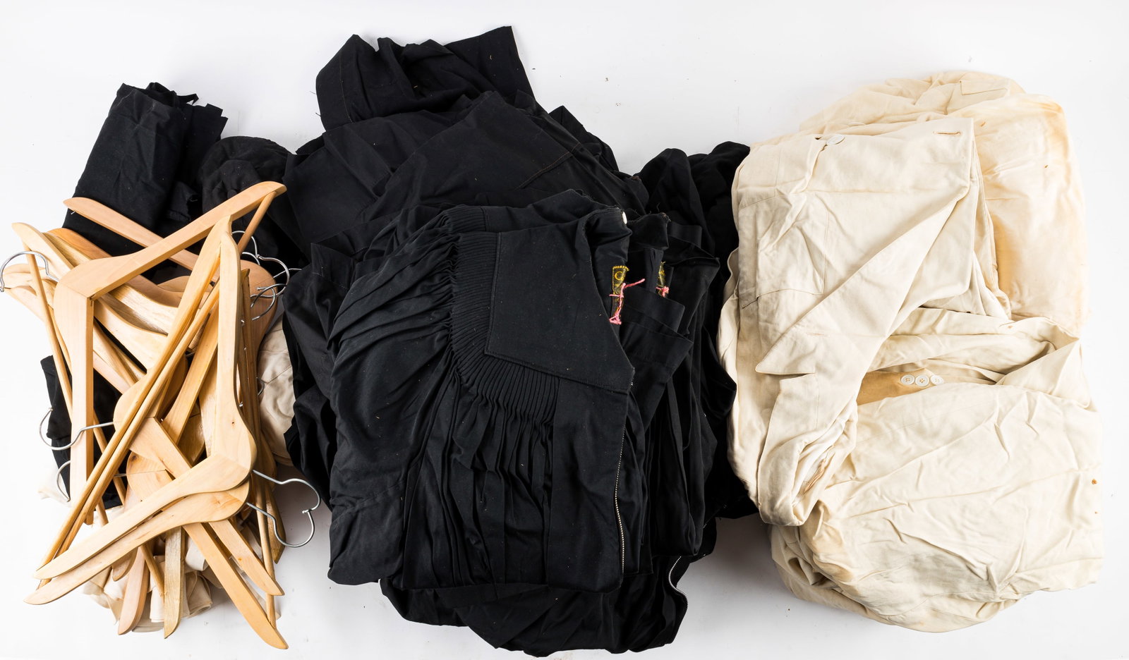 Vintage Graduation Gowns, Blazers, Caps: Large lot of vintage Cotrell and Leonard graduation caps and gowns including seven long black zipper up the front gowns, seven white double breasted blazers (some with maker label) and 1 white gown th