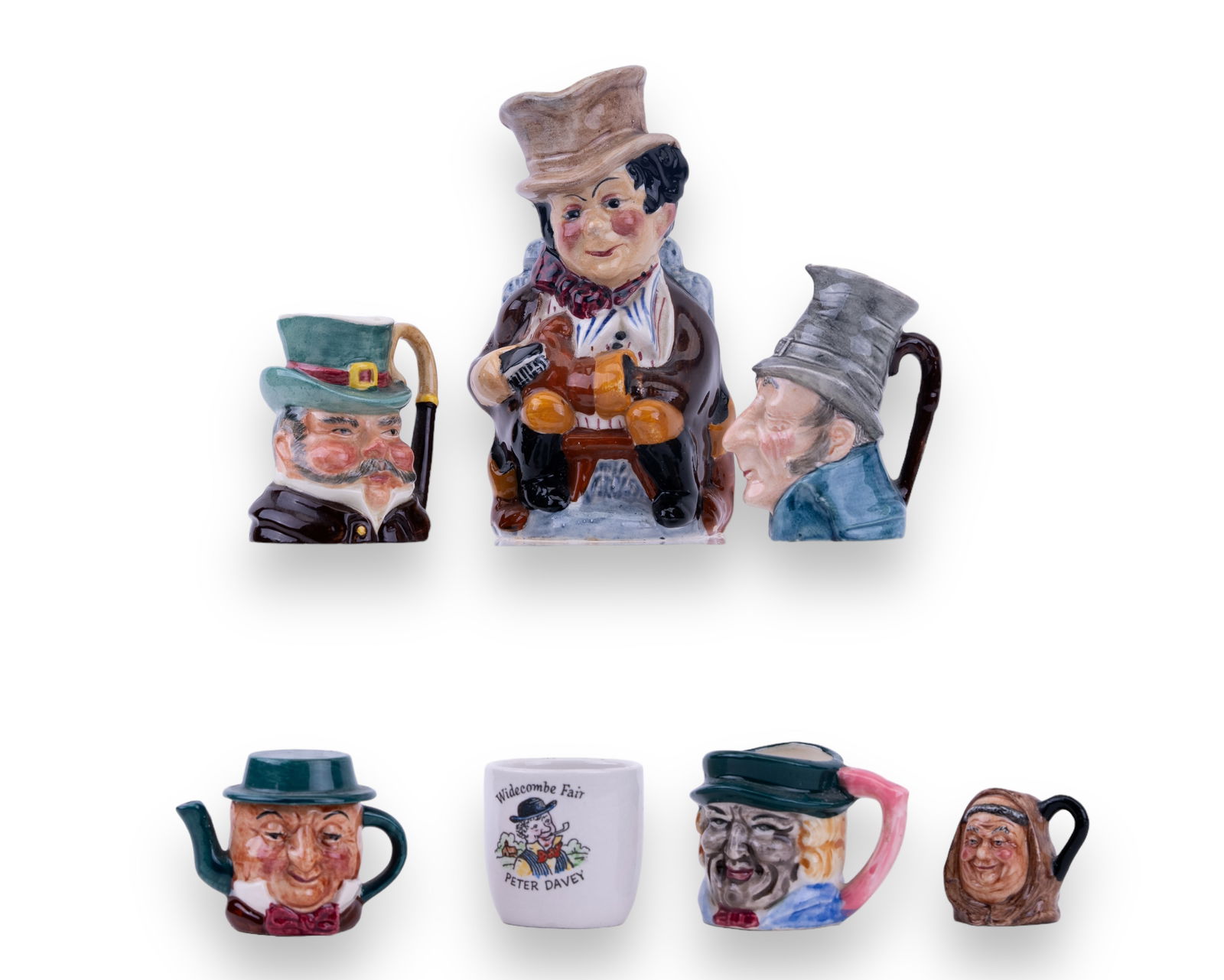 Toby Type and English Mugs & More: Toby mugs include two by Kelsboro Ware England, a tea kettle shaped man with hat lid by Artone England, small Friar Tuck by P. Jackson, and a Japan made black faced figure. Lot also includes a Toby Ju