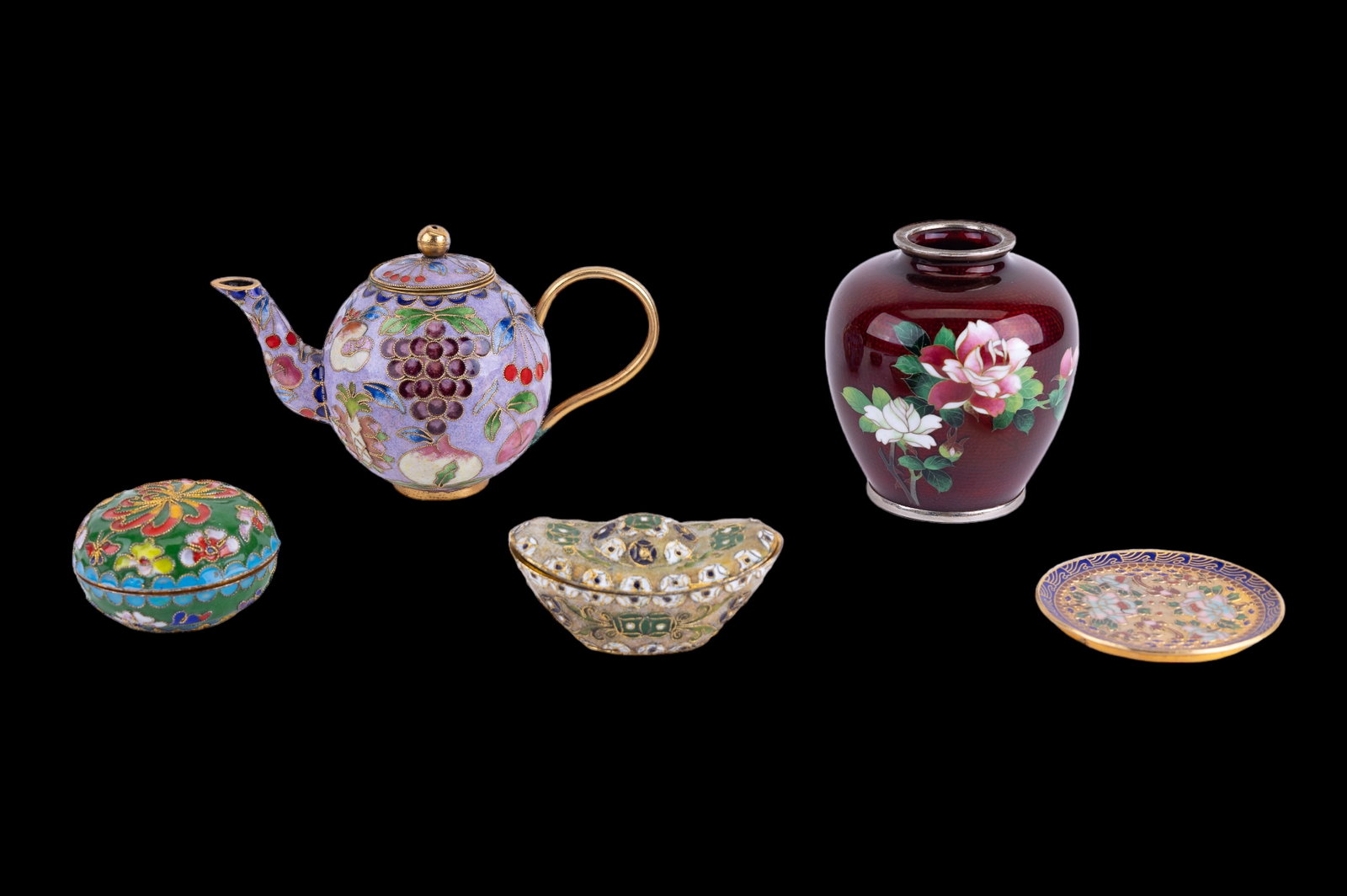 Cloisonne and Enameled Decoratives: Five pieces of Cloisonne accents including enameled pigeon blood enameled vase and cloisonne teapot, two small lidded boxes and a small spoon plate. Vase approx 3.75" H.