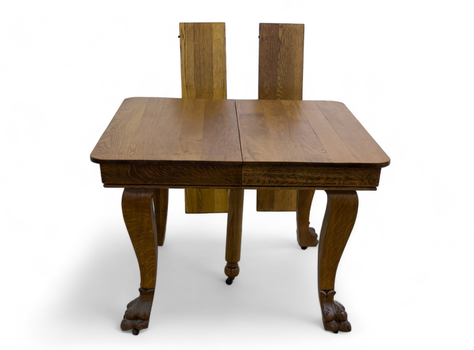 Oak Dining Table w/Paw Feet C 1910: Oak Dining Table w/Paw Feet C 1910 measuring approx 29 x 42 x 42in and each leaf is approx 10in.