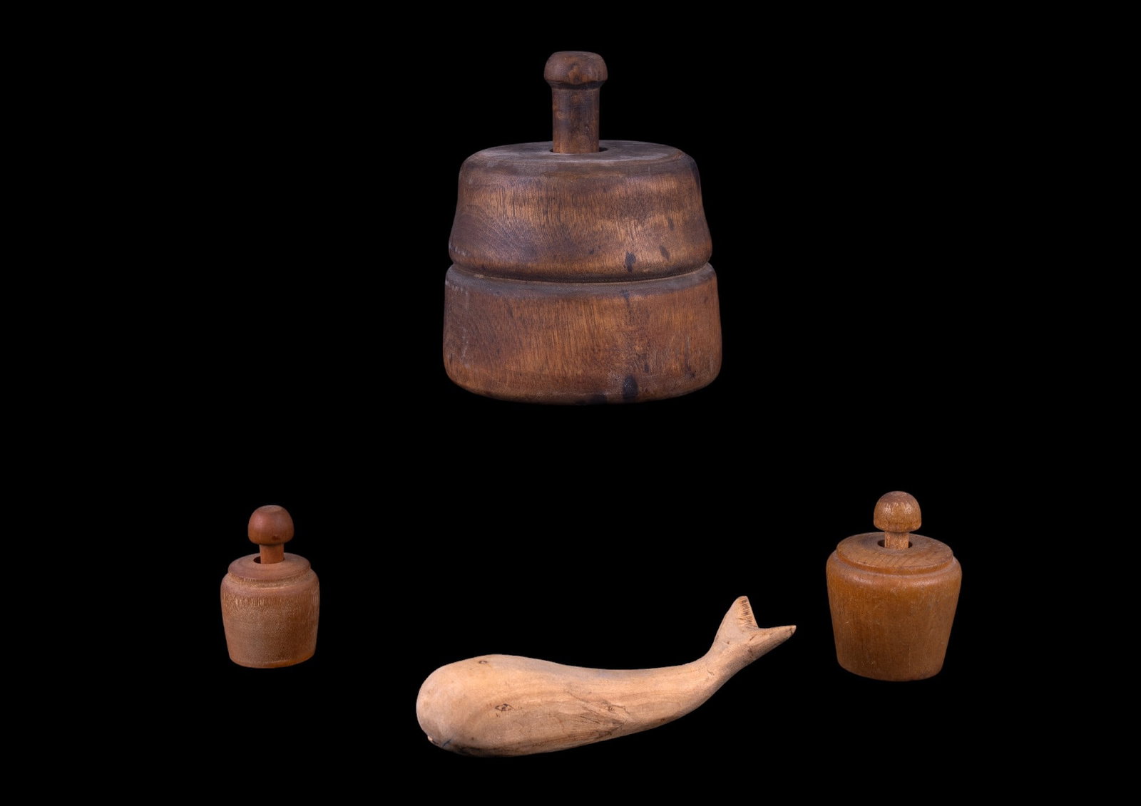 Antique Butter Stamps and Folk Art Whale: Includes 3 wood butter stamps with New England and Pennsylvania designs. Largest measuring approx 4.5" dia x 5.5 H. Also included is a hand carved and signed wooden whale measuring approx. 5.75" L.