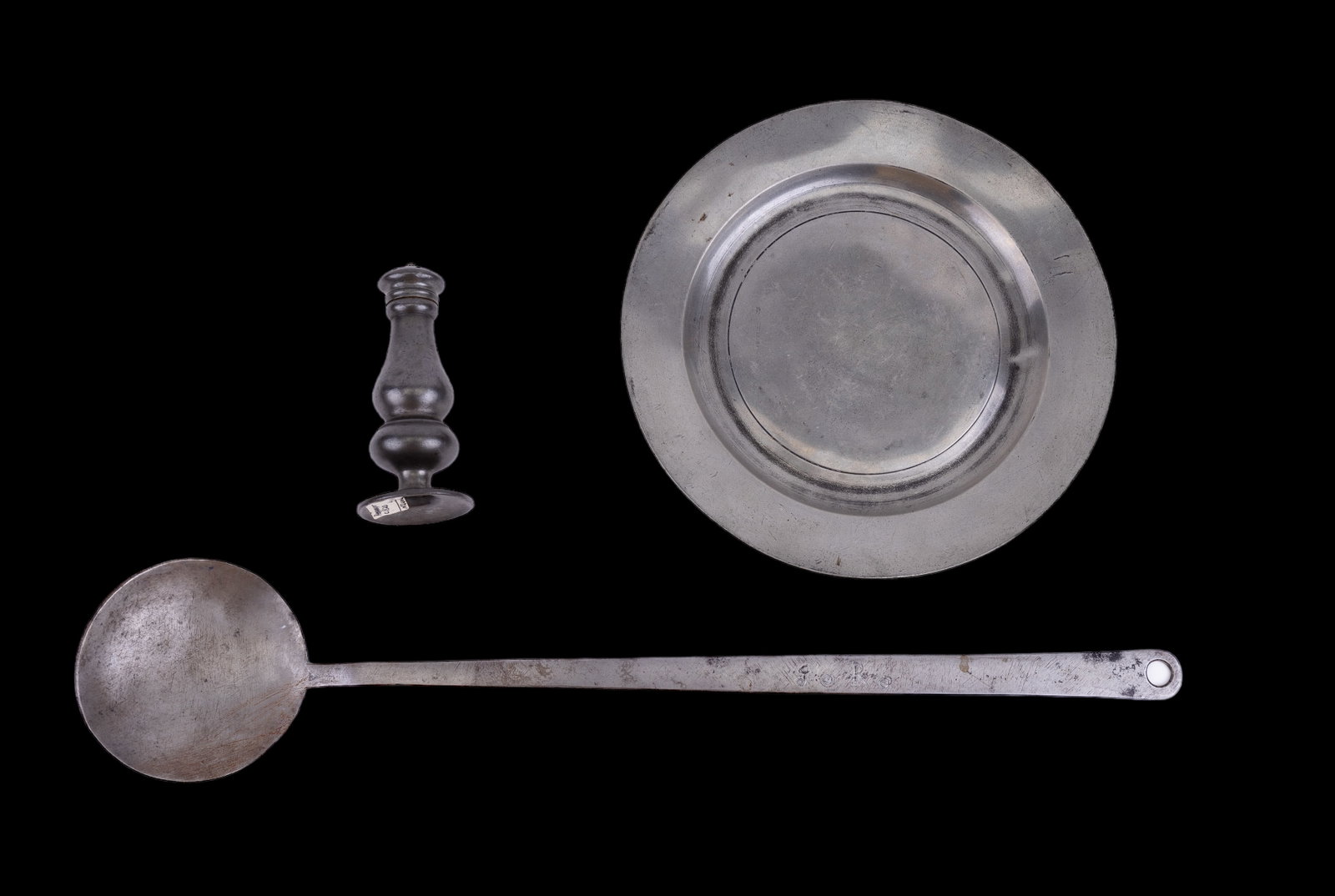 19th C Pewter and Hearth Implements: Lot includes an English pewter pepper pot circa 1820, an 8 3/4" pewter plate circa 1830 (unmarked), and a 19th century hearth implement skimmer initialed "Jo Ro".