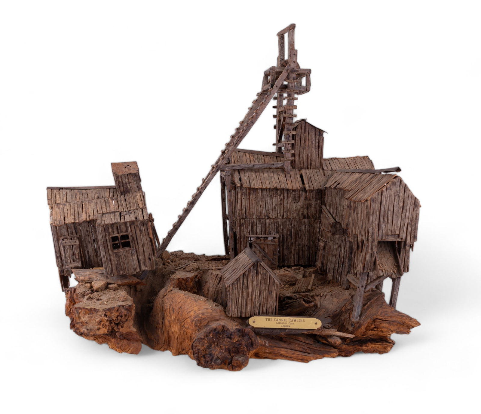 J. Shiew's "Fannie Rawling Mine" Diorama: Fannie Rawling mining facility diorama / model created with raw wood pieces and mounted on raw wood burl. The lead mining facility is located in Leadville, Lake County, Colorado. There is a front bras