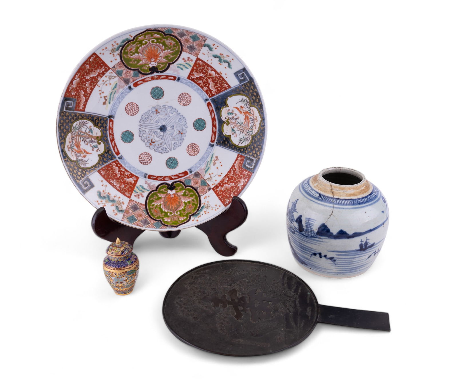 Imari Charger and Asian Decoratives (4): Large Japanese Imari charger with floral and bird designs measuring approx. 13.5 dia and 16" H in stand, Japanese bronze hand mirror, late Ming ginger jar, and small cloisonne lidded ginger jar.