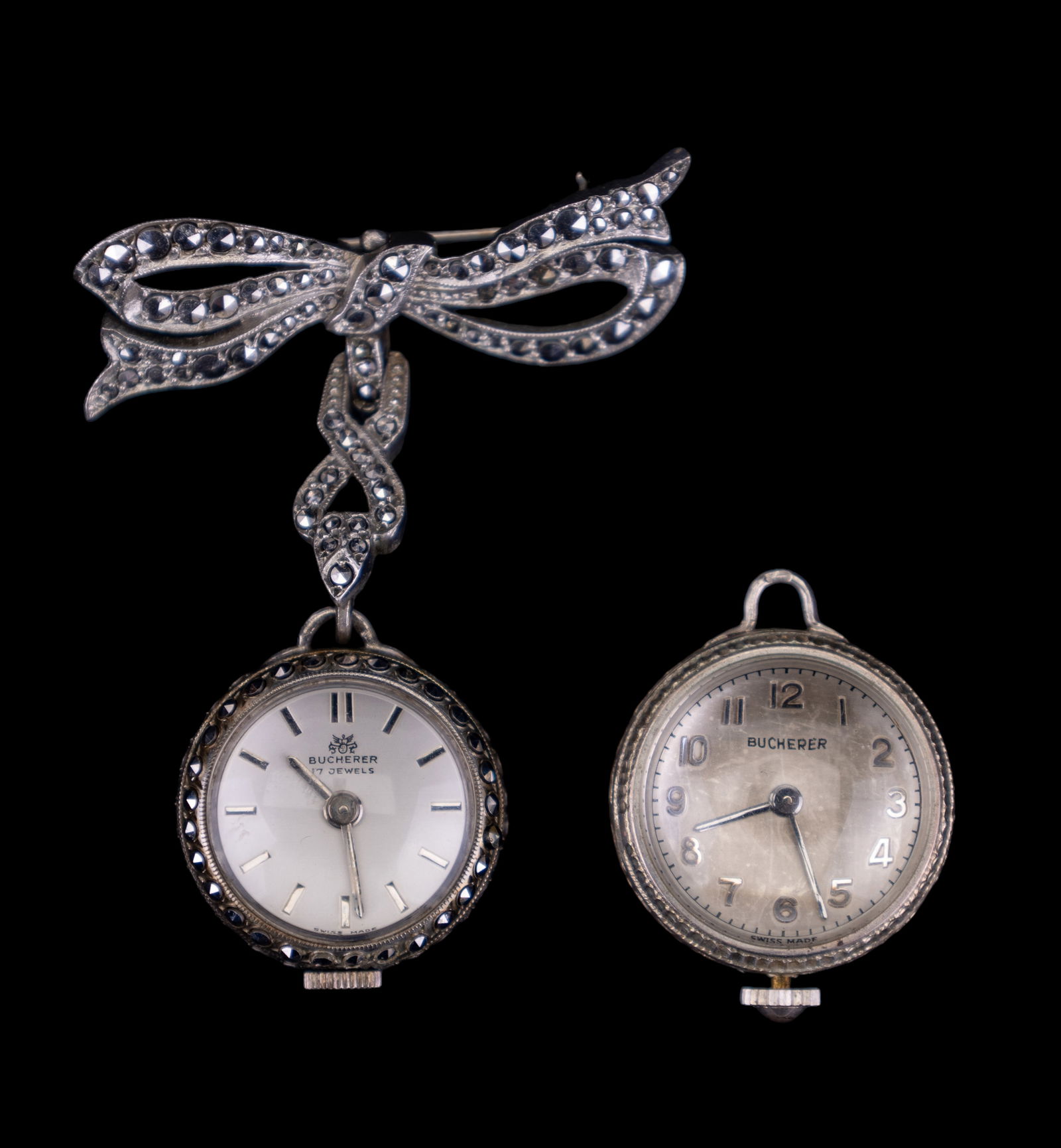 Bucherer Early Swiss Watches: Bucherer early Swiss Watches, from the 1940s. Fine Bucherer Swiss .800 silver 17 jewel marcasite skeleton bow pendant watch pin in working order, and a Bucherer skeleton watch without pin, in as found