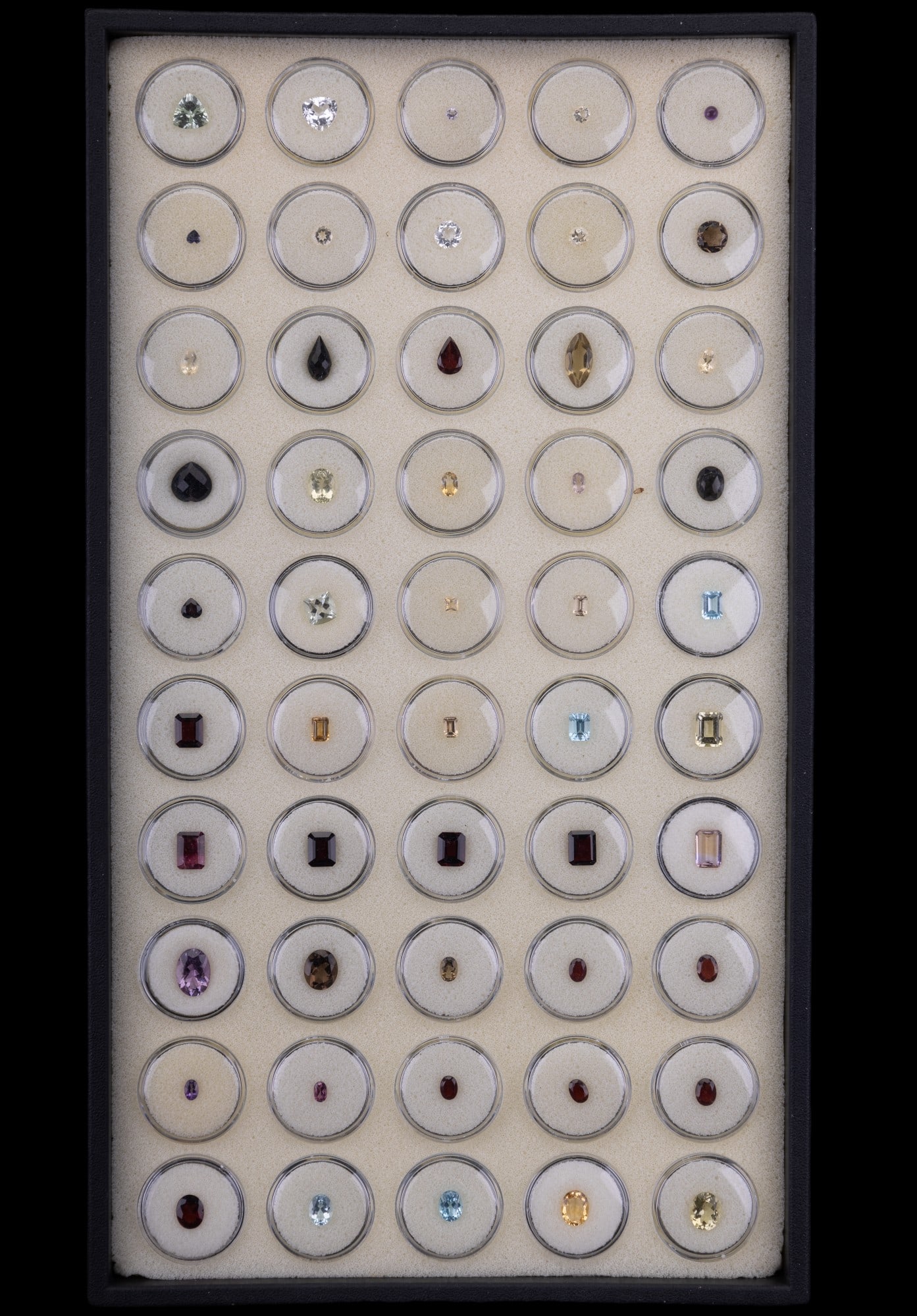 Semi-Precious Faceted Gemstones: Semi-Precious Faceted Gemstones. 50 gemstones, in individual lucite holders.