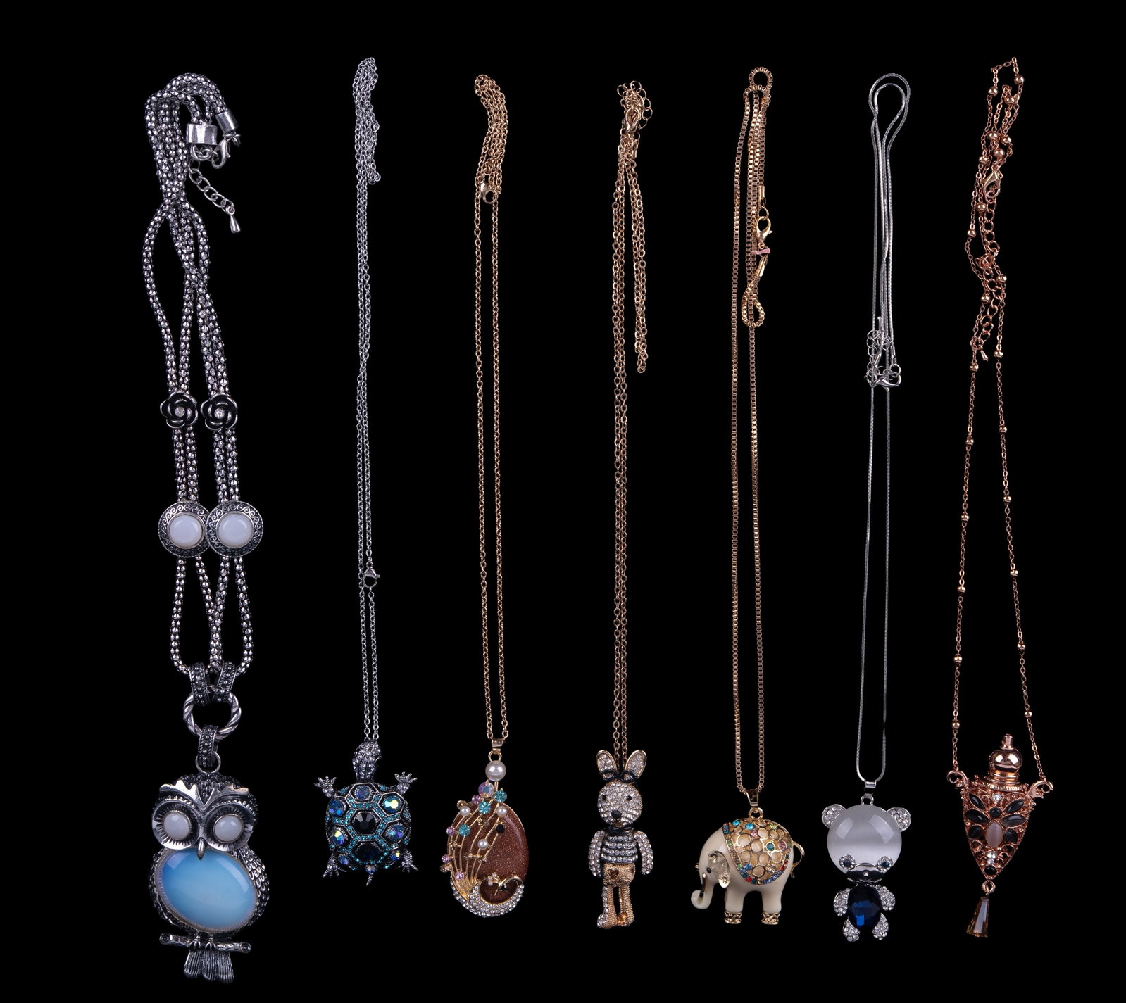 Collectible Cocktail Necklaces: Collectible Cocktail Necklaces with Animal themes - 7 necklaces, including a turtle, owl, elephant, etc. All stones appear to be glass.