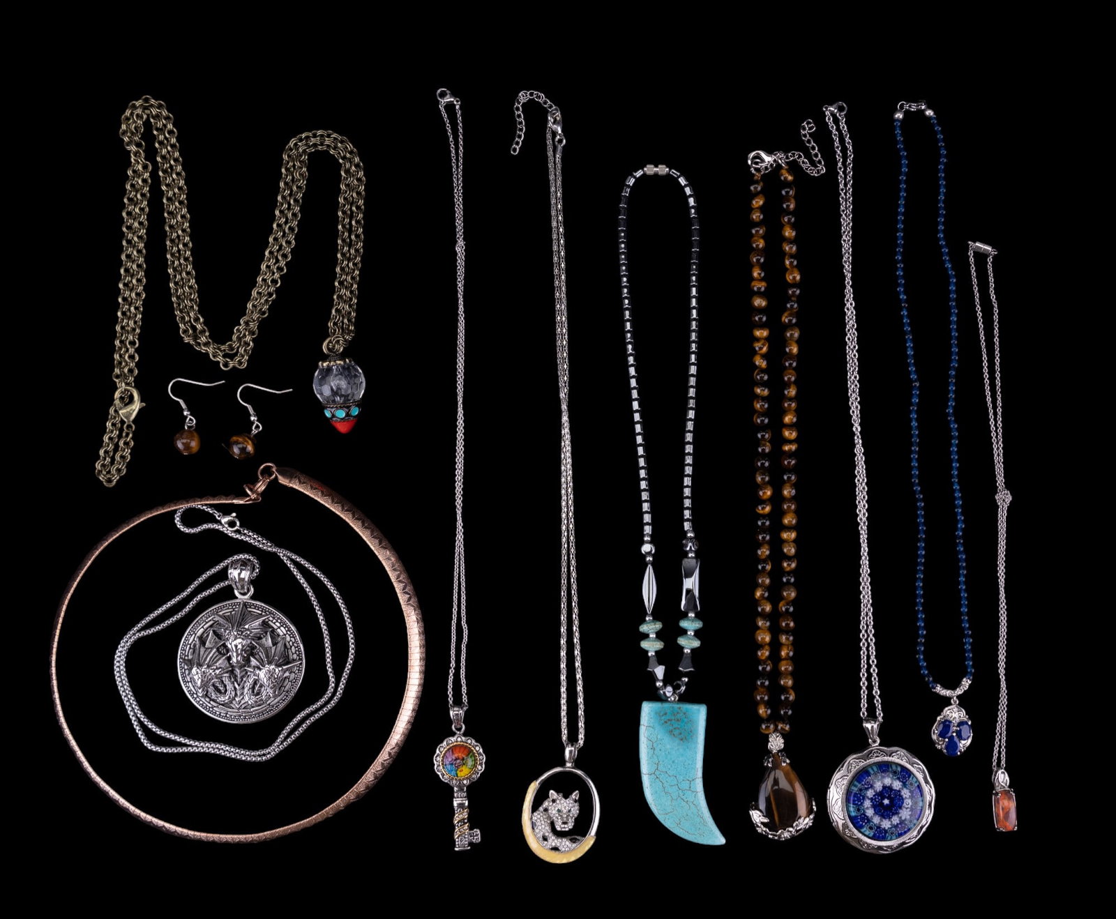 Collectible & Semi-Precious Necklaces: Collectible & Semi-Precious Necklaces. Ten (10) necklaces of tiger eye (with a matching pair of earrings), howlite, aquamarine, lapis, kyanite, glass hematite, enamel, and art glass.
