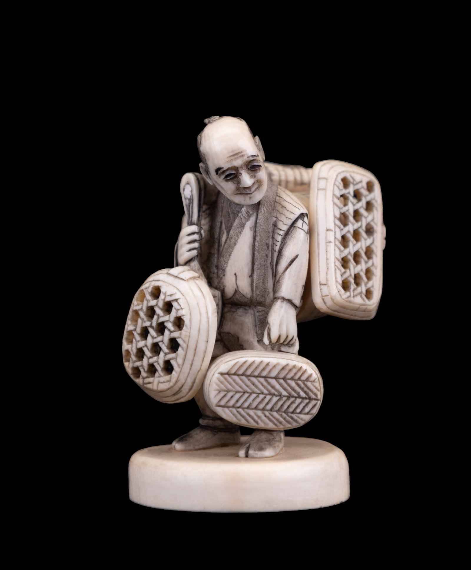 Japanese Meiji Period Basket Seller: Japanese Meiji period basket seller carved of natural material and maker's mark on bottom measuring approx. 2.5" H.