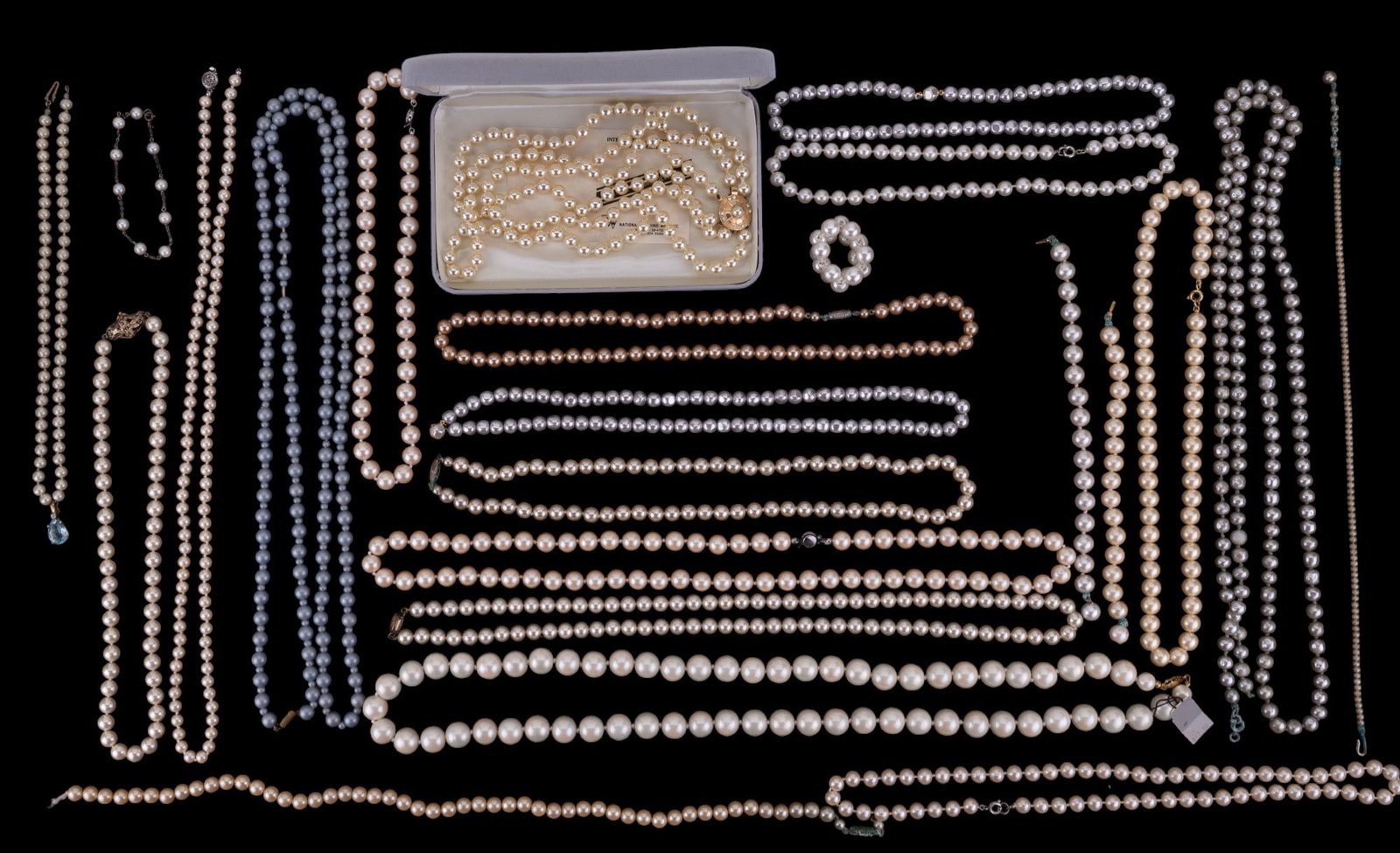 Faux Pearl Necklace & Bracelets: 22 pairs Faux pearl necklaces & bracelets. Includes string of Mallorca pearls in original box with paper, string of Deauville pearls with original tag.