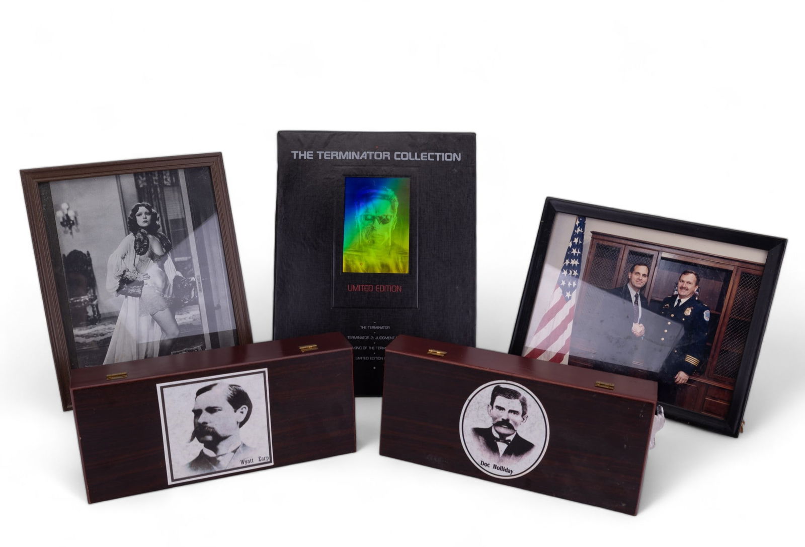 Wild West Novelty Knives and More: Wyatt Earp & Doc Holliday commemorative folding gun knives with holsters and bio sheets in wooden display cases measuring 11" L x 5" W x 2" H, Terminator special edition VHS set in slip case (with wea