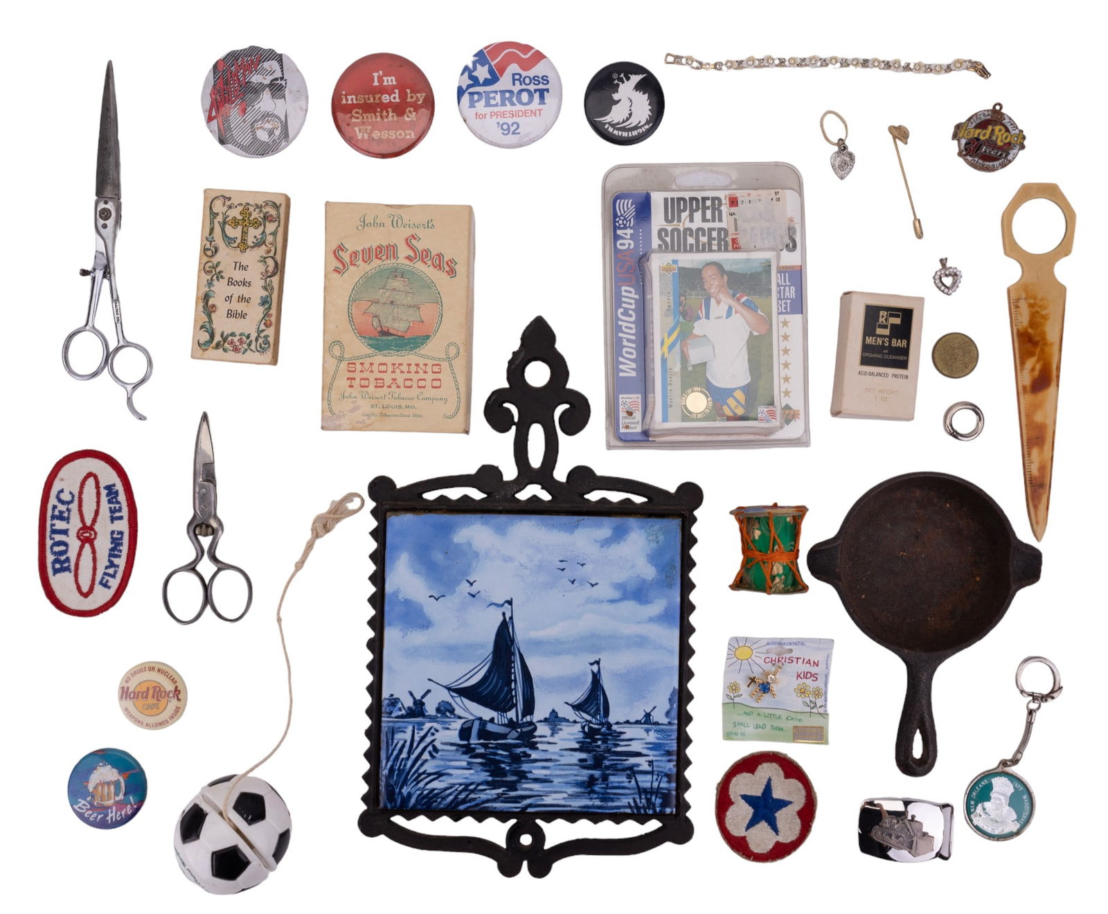 Misc. Collectibles (20+ Items): Collection highlights include Delt ship scene tile trivet, small cast iron pan approx. 3.5" Dia, bone letter opener with magnifying glass and ruler, tobacciana, pair of sewing scissors, novelty button