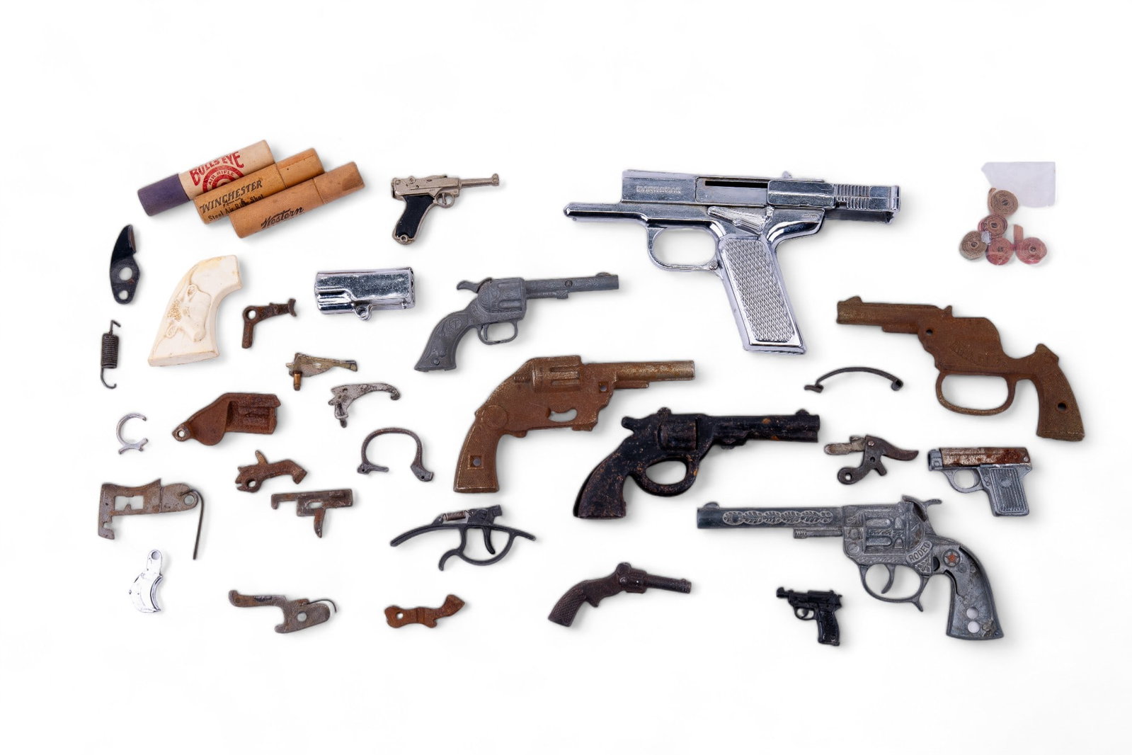 Vintage & Collectible Toy/Cap Guns w/ Parts: Vintage and collectible toy + cap guns. Seven guns are present, along with parts to be used for restorations. Standouts include a Morton H. Harris toy gun, two "western revolvers" and more.
