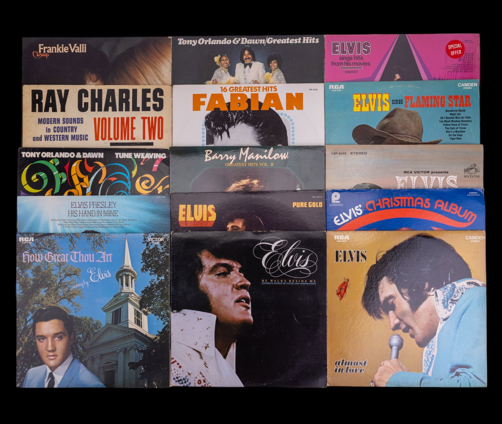 Elvis, Frankie Valli, & Other Vinyl (15): 9 assorted Elvis albums including soundtracks, devotional, and holiday. Others by Frankie Valli, Ray Charles, Tony Orlando (2), Barry Manilow, and Fabian. Most are good and a few are good to fair.