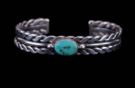 Sterling Silver Vintage Turquoise Bracelet: Handmade sterling silver bracelet set with bright turquoise stone.