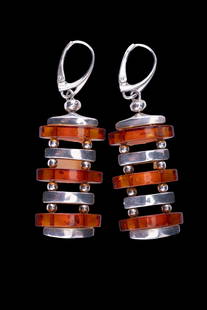 Baltic Amber Sterling Silver Earrings: A pair of baltic amber and sterling silver earrings.