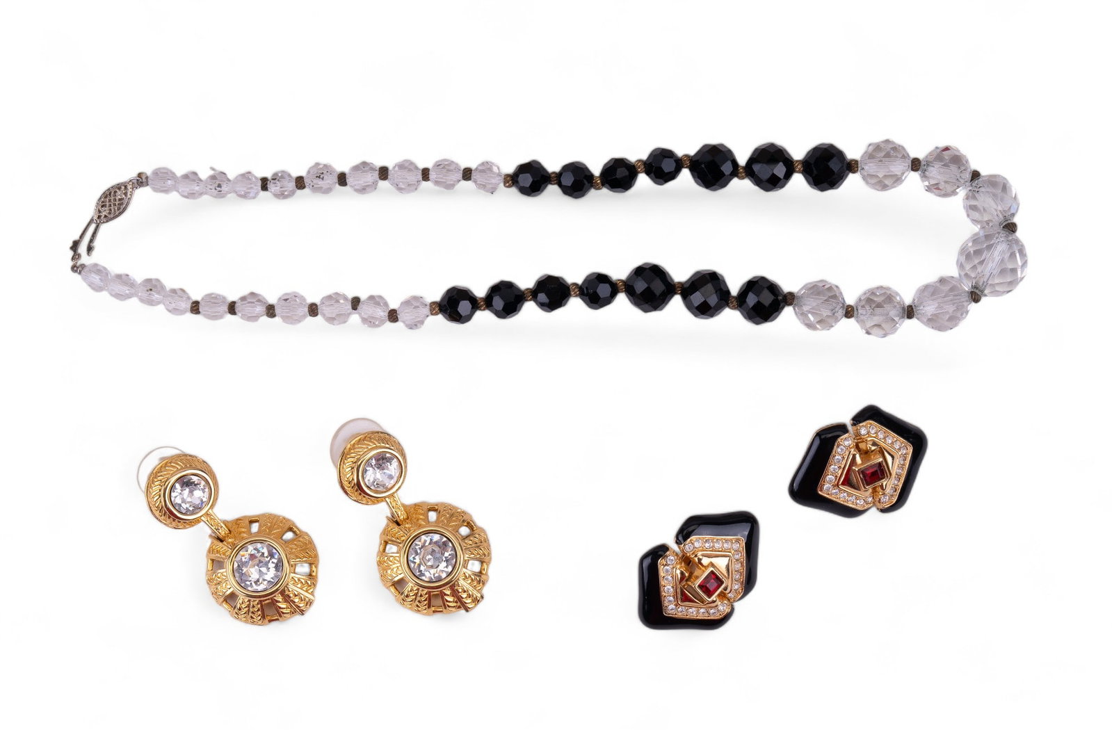 Swarovski Crystal, Sterling Crystal Necklace: A sterling silver clear and black crystal necklace with sterling clasp, along with two pairs of marked Swarovski earrings.