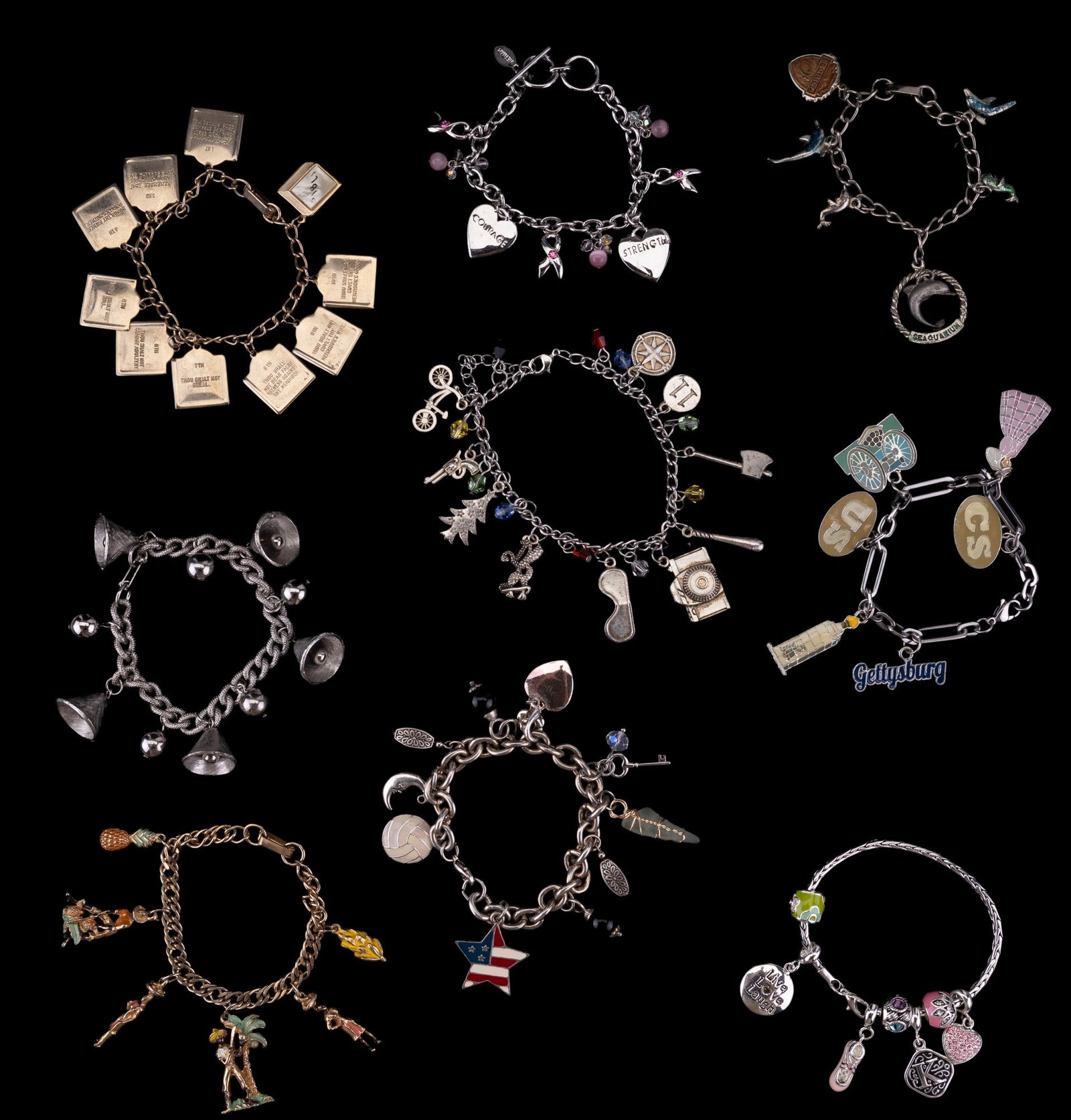 Vintage & Costume Charm Bracelets: 9 vintage and costume charm bracelets featuring a vintage Jamaican/Island bracelet with figures, bananas, and pineapple charms; a vintage Florida/Seaquarium bracelet; a vintage 10 commandments bracele
