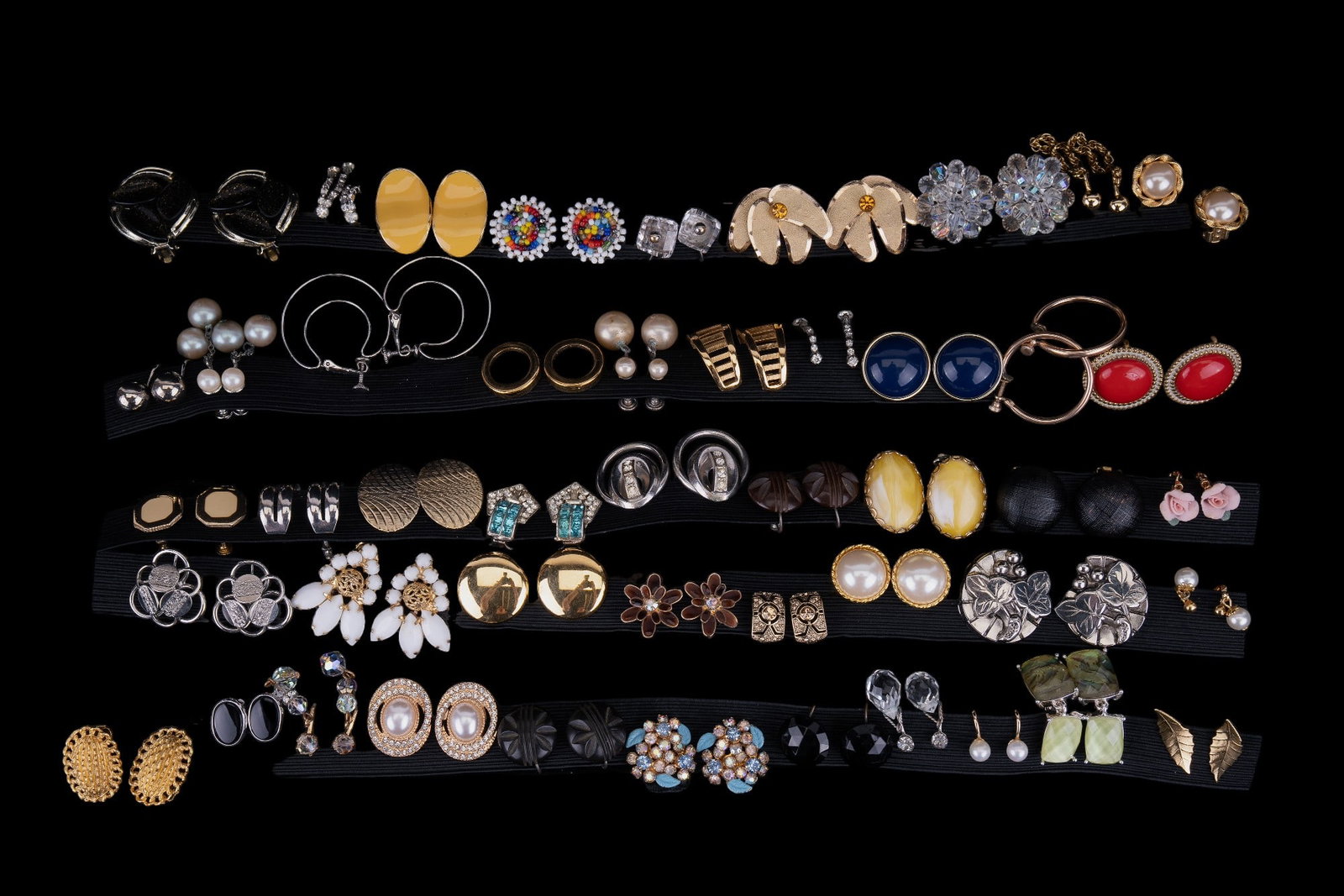 Weiss, Lisner, Vendome, Trifari Earrings: 47 pairs of clip and screw-back earrings featuring sterling Vendome, sterling and crystal, Weiss NY with pronged rhinestones, Weiss brown enamel flowers with pronged rhinestone centers, Lisner silver