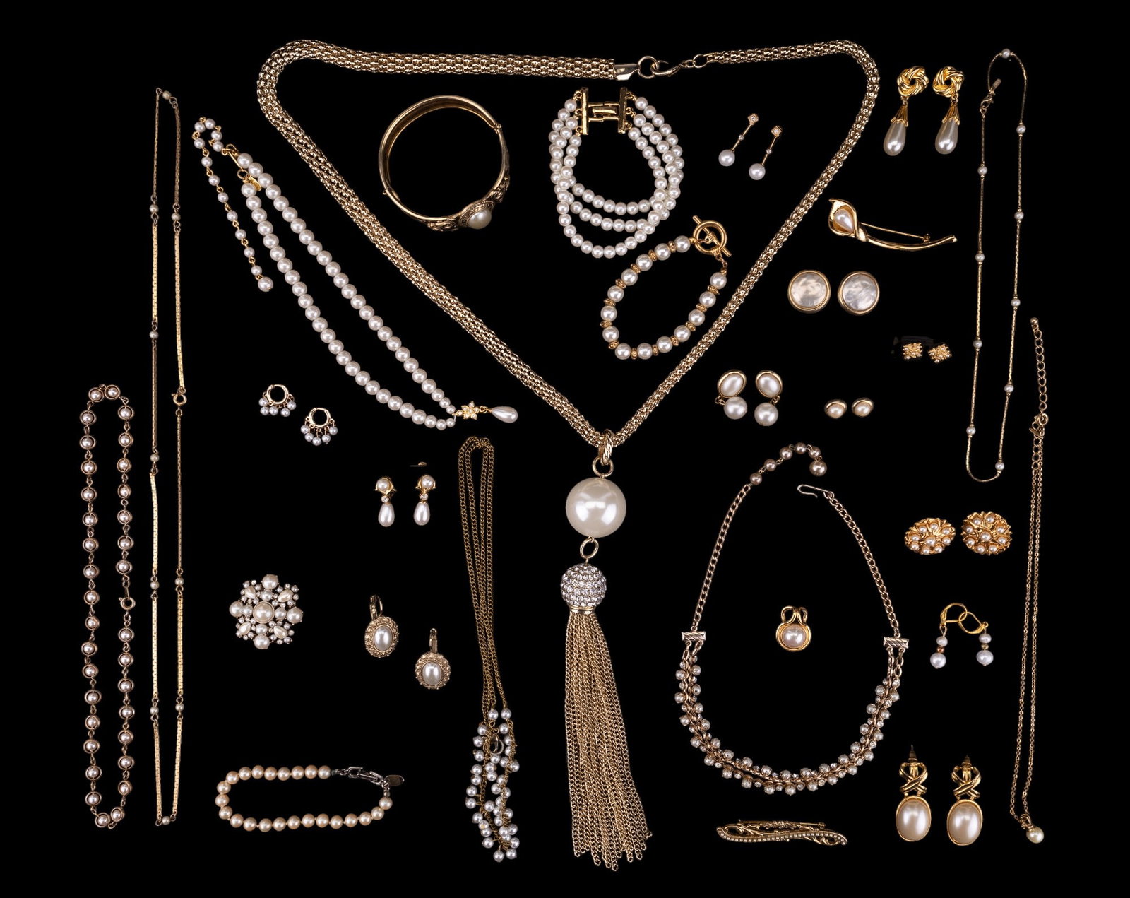 Faux Pearl Costume Collection: Faux pearl costume collection featuring Napier, Monet, Avon, and more necklaces, earrings, bracelets, pins, and one pendant. 28 pieces.